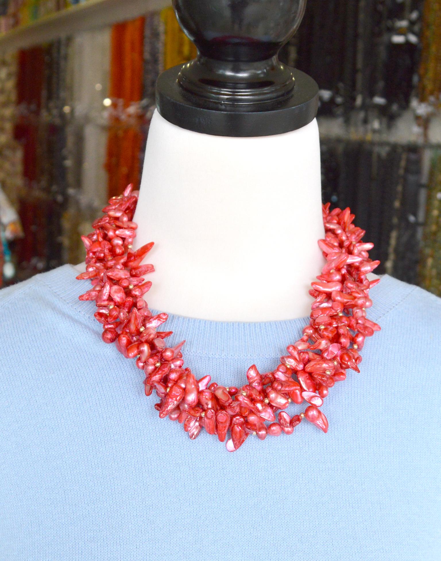 5 strands of dyed pink Fresh Water Blister Pearls and 14k gold filled 3mm round beads, finished with Gold plate copper cap and lobster clasp with a 6cm extension chain. 
Total length of necklace 54cm untwisted.

