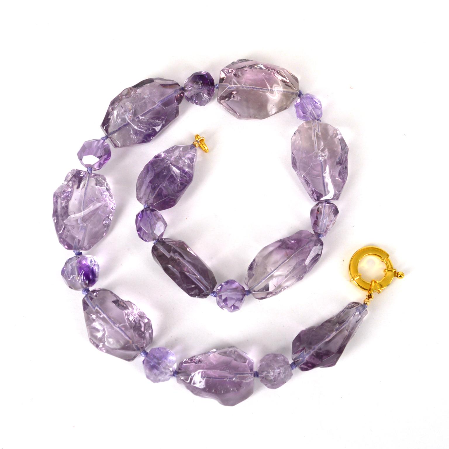 Purple Ice is what these lovely hammered Amethyst beads look like. Necklace is made from 10 pieces of 33-39mm hammered  finished clean Amethyst beads and 9 pieces of approx 14mm hammered  finished Amethyst beads hand knotted on purple thread with