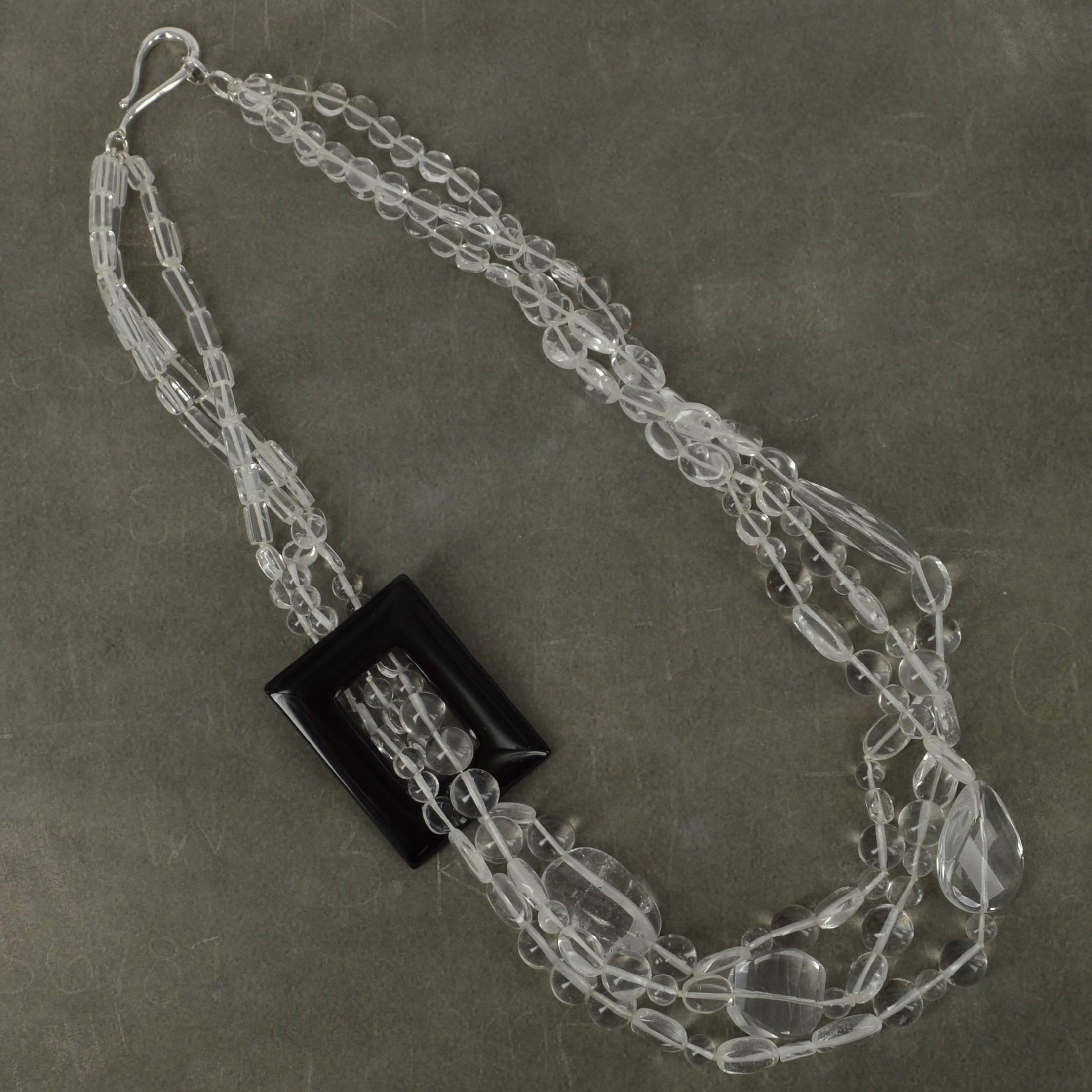 Statement 3 strand torsade style necklace created with Clear Rock Crystal beads in many sizes flowing through a 45x35mm Black Agate Rectangular frame bead hand knotted for strength and durability with a 34mm Sterling Silver Clasp. 

Finished