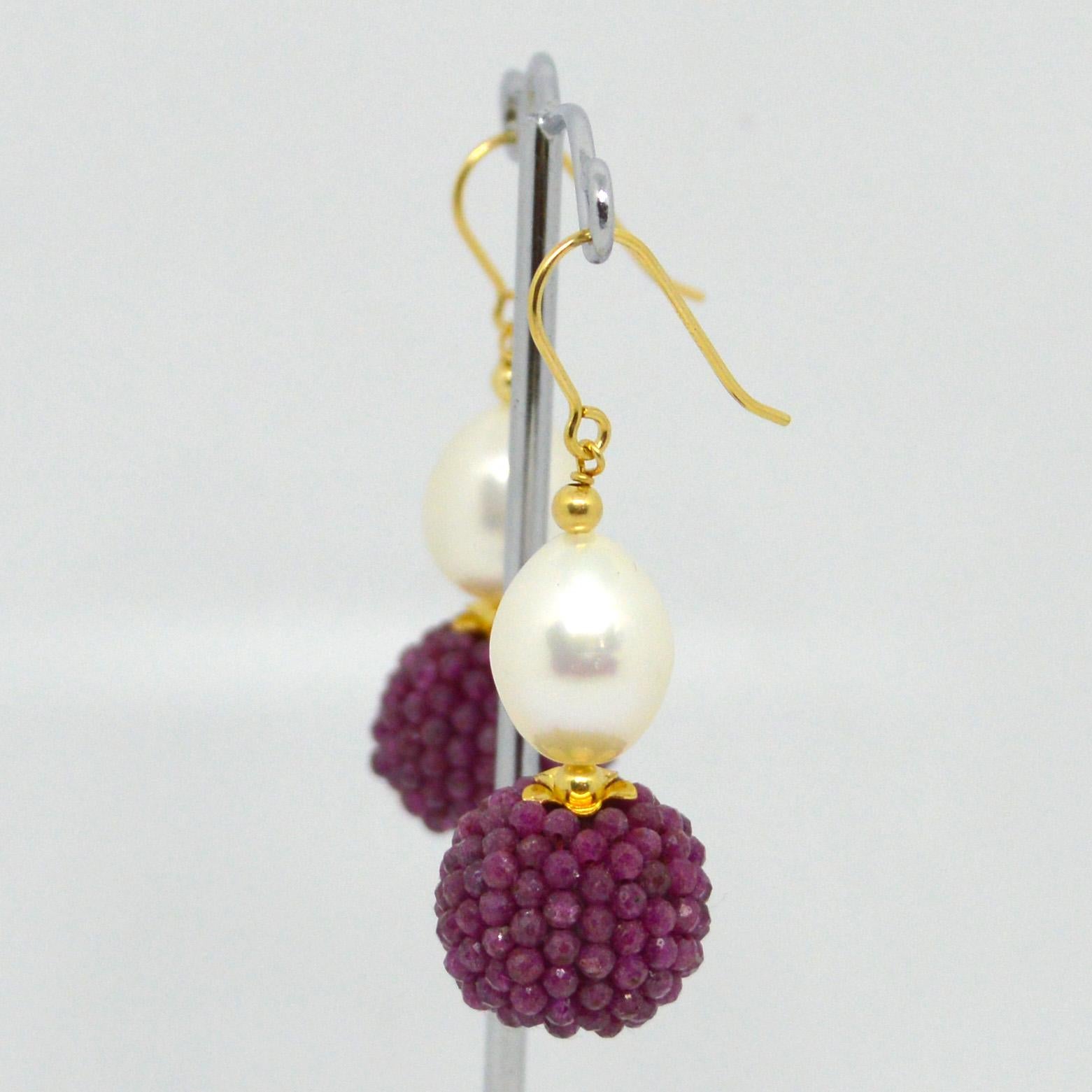 Natural Freshwater Pearl 15x10mm with a hand made beaded bead of natural Ruby mirco faceted beads 14k Gold Filled headpin and 3mm beads and Sheppard.

Total Earring length 45mm.
