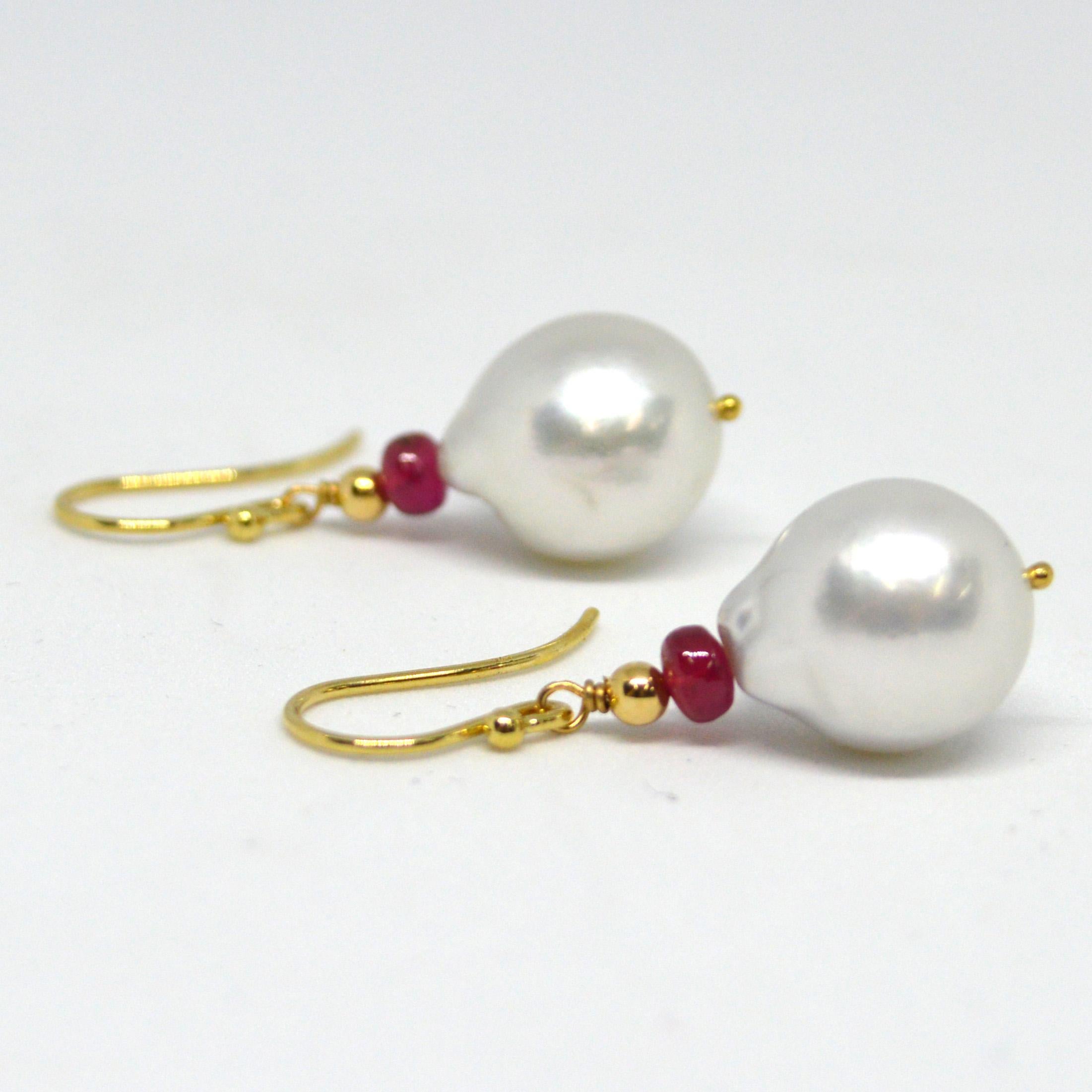 Natural Brazilian Rubies 3x4mm with 15x12.7mm high sheen South Sea Pearls set on 9ct yellow Gold Sheppard,  14k Gold head pin and 3mm round bead.

Total Earring length 36mm.