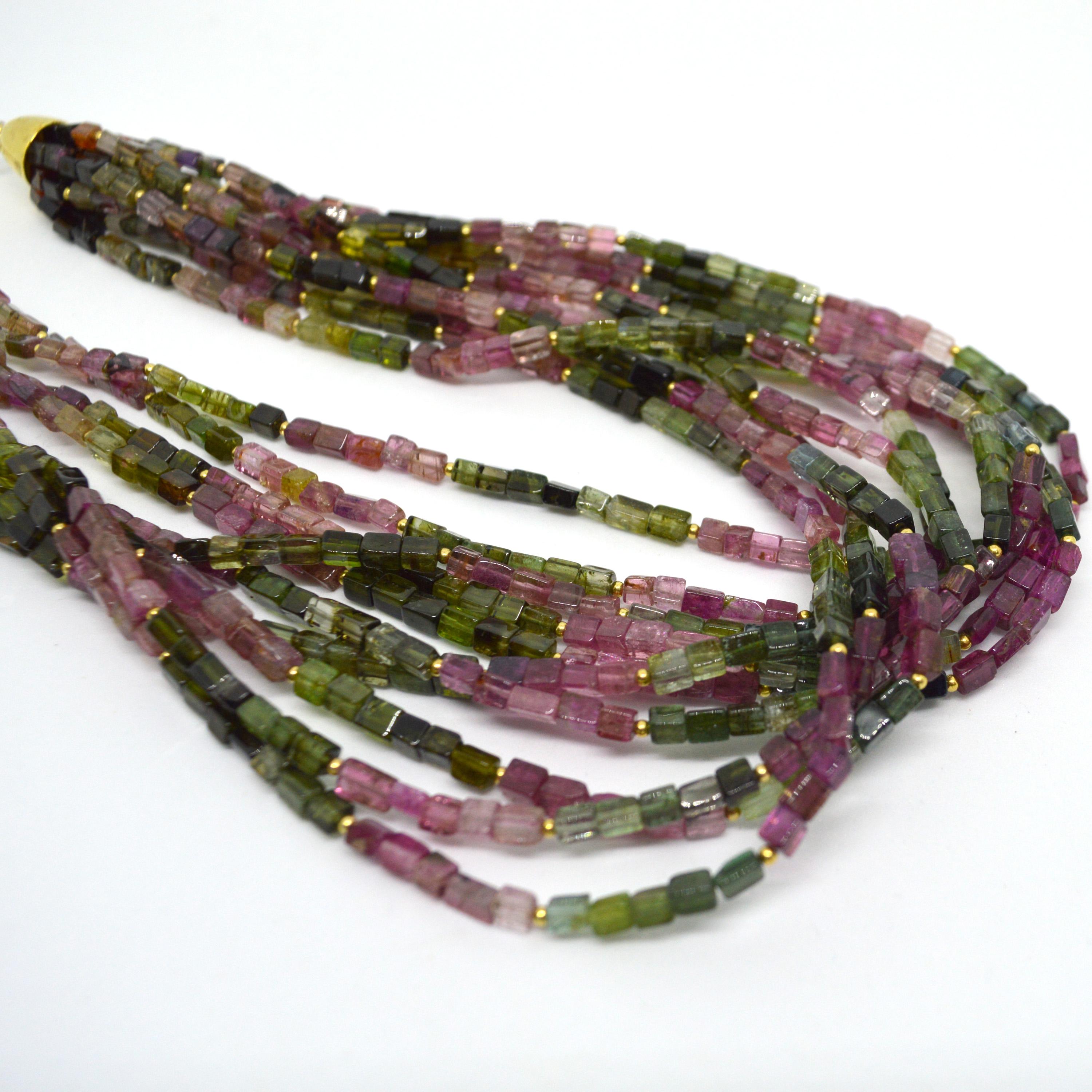 What a statement this necklace makes with 10 strands of vibrant multi coloured Tourmaline beads, each bead is approximately 3x5mm and have accent 2mm 14k Gold filled round beads for additional sparkle 
Necklace if finished with a high polish Gold