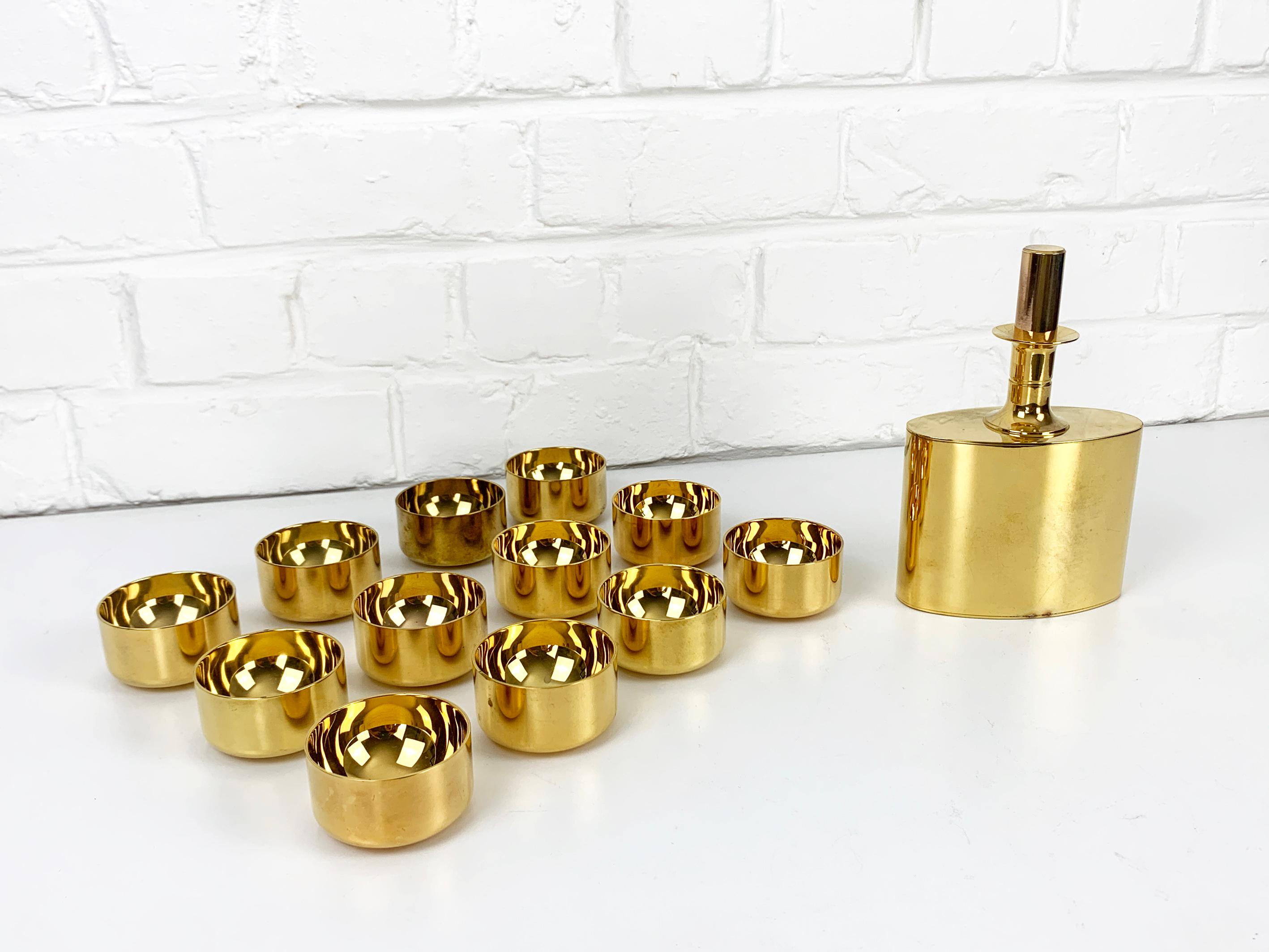 Swedish Decanter & 12 bowls in gold plated brass, Pierre Forsell for Skultuna, 1960s For Sale