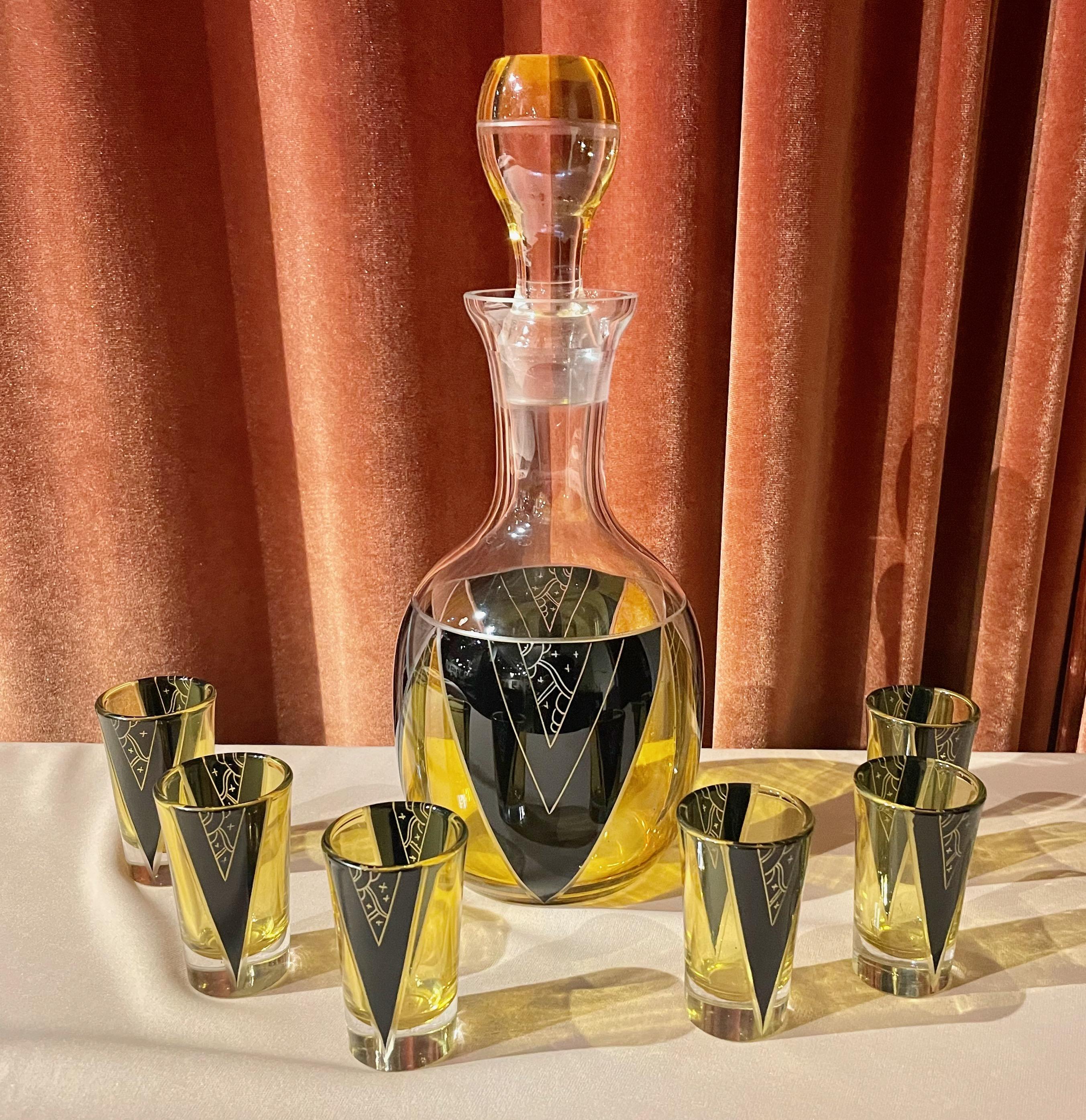 An original Art Deco decanter set by Karl Palda, the master of Czechoslovakian glass design. This decanter is a bit unusual: It has an oversized round pouring spout and is capped with an oversized domed stopper. The design and on the decanter has a