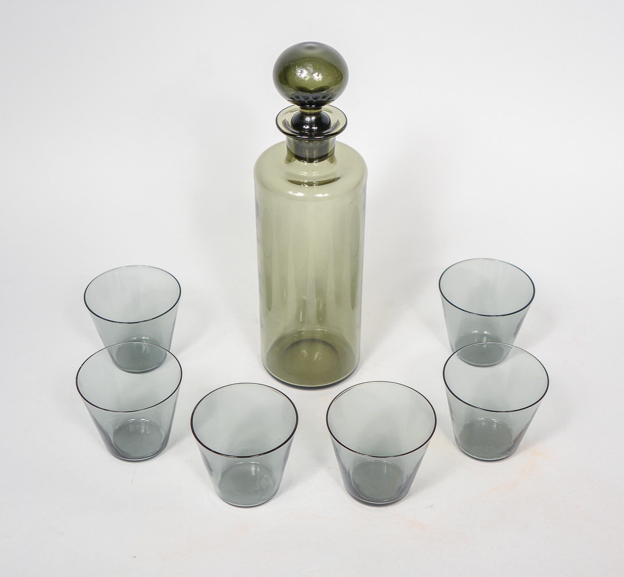 Set of Nuutajarvi decanter and glasses. The decanter is attributed to Saara Hopea and the glasses are by Kaj Franck.