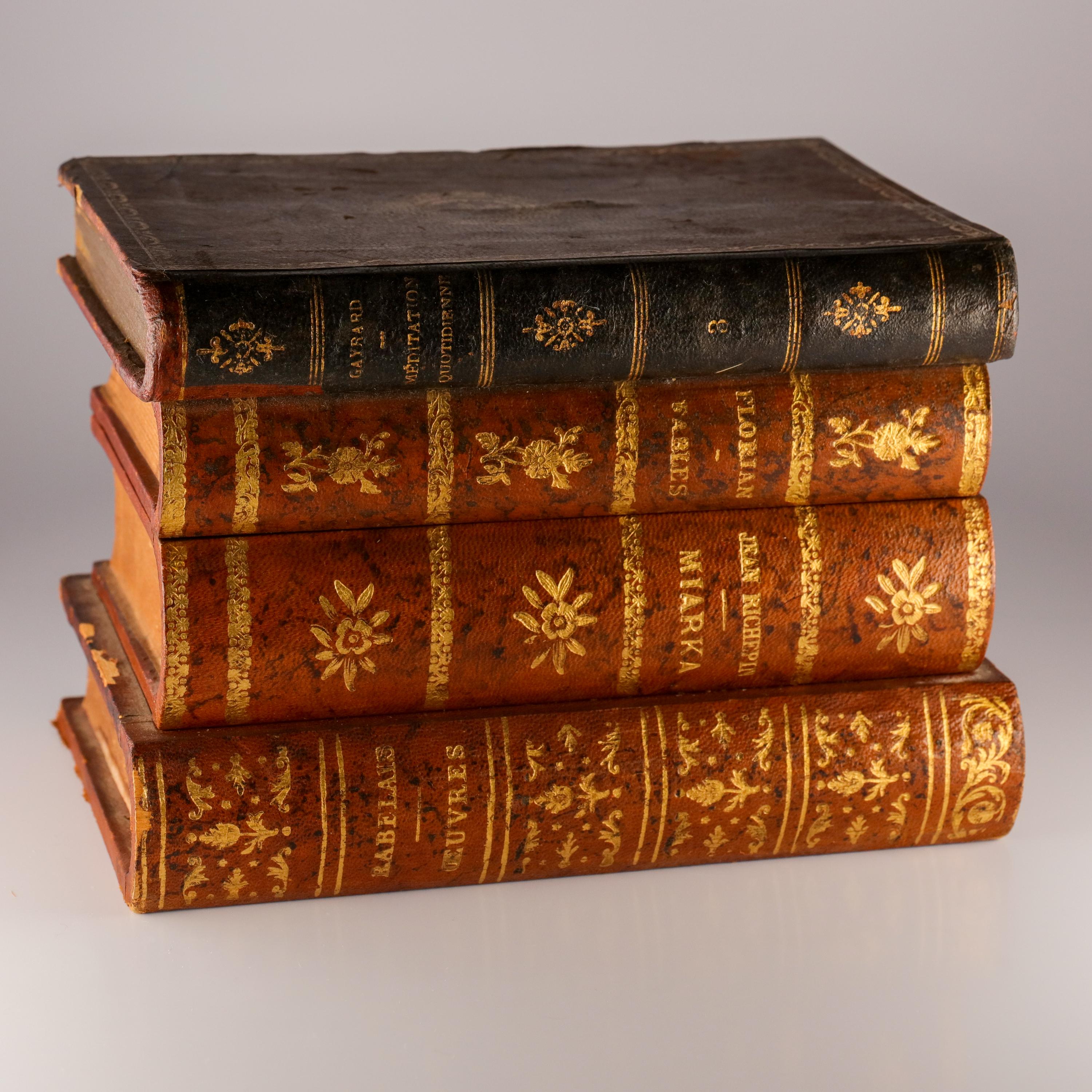 From a distance, it's just a stack of lovely antique leather-bound French books. But lift the top book and a cunning brass hinge is deployed, raising the 