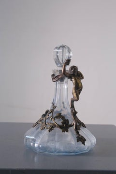 Italian Art Nouveau-era decanter with bronze decorations