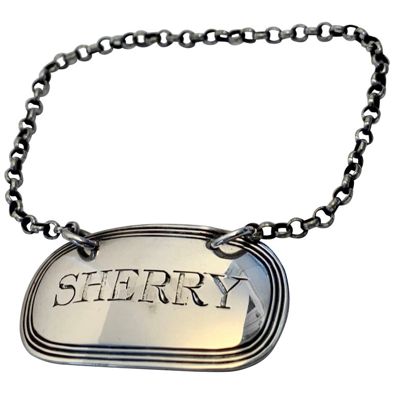 Solid silver decanter labels