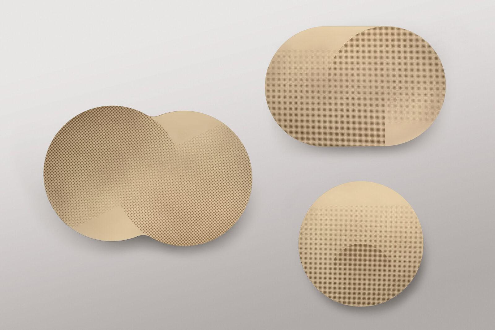 The Flocks table collection was inspired by the sinuous and hypnotic movement of flocks of birds in the autumn sky. The tops of these side tables are made of sheets of brass or copper, in simple circles or intersecting circular shapes, resting on