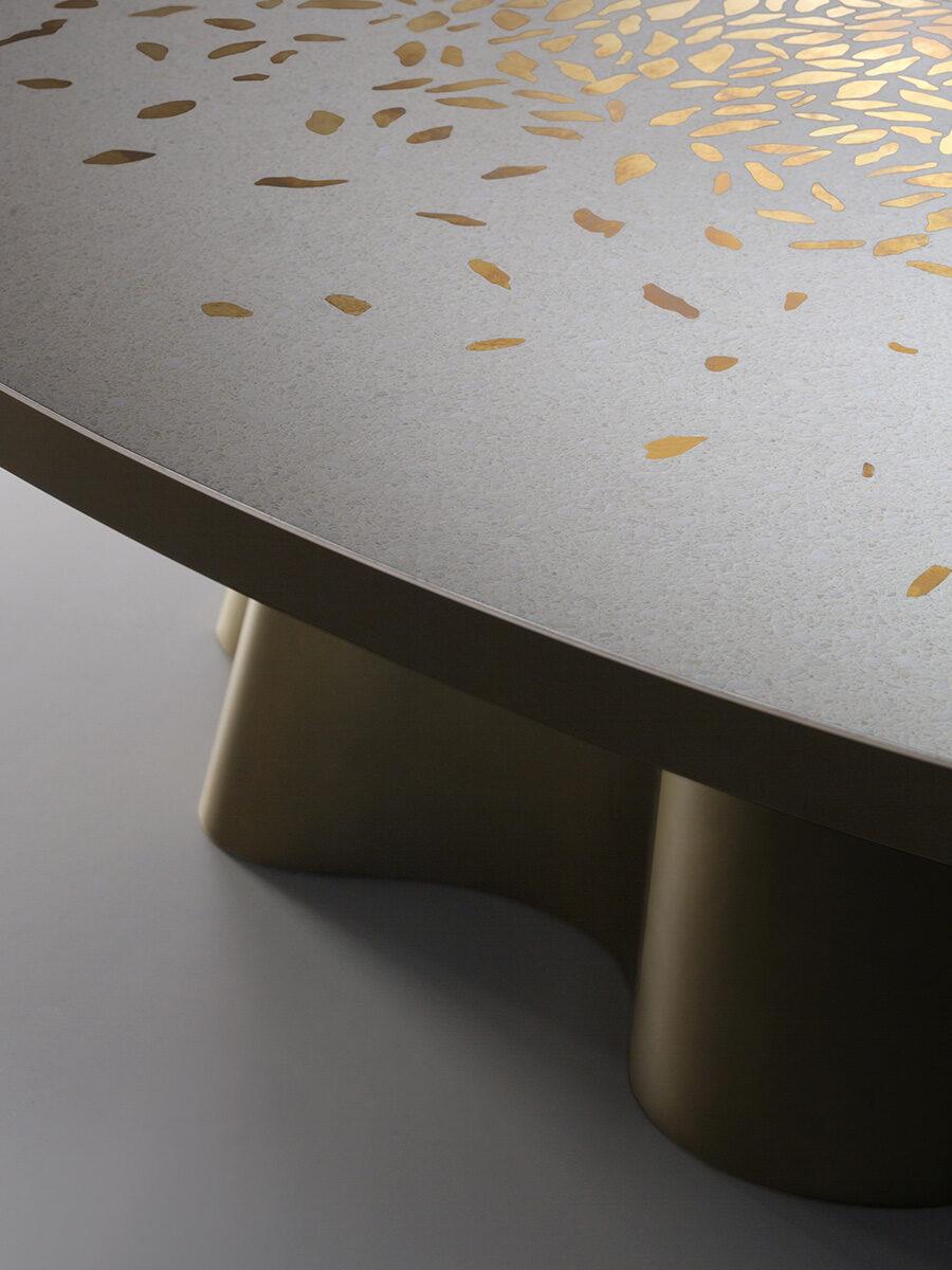 Vela is a table-sculpture that explores and enhances the different facets and uses of metal. The stately oval top in Venetian terrazzo made of white marble has been crafted in collaboration with Laboratorio Morseletto to embrace small pieces of