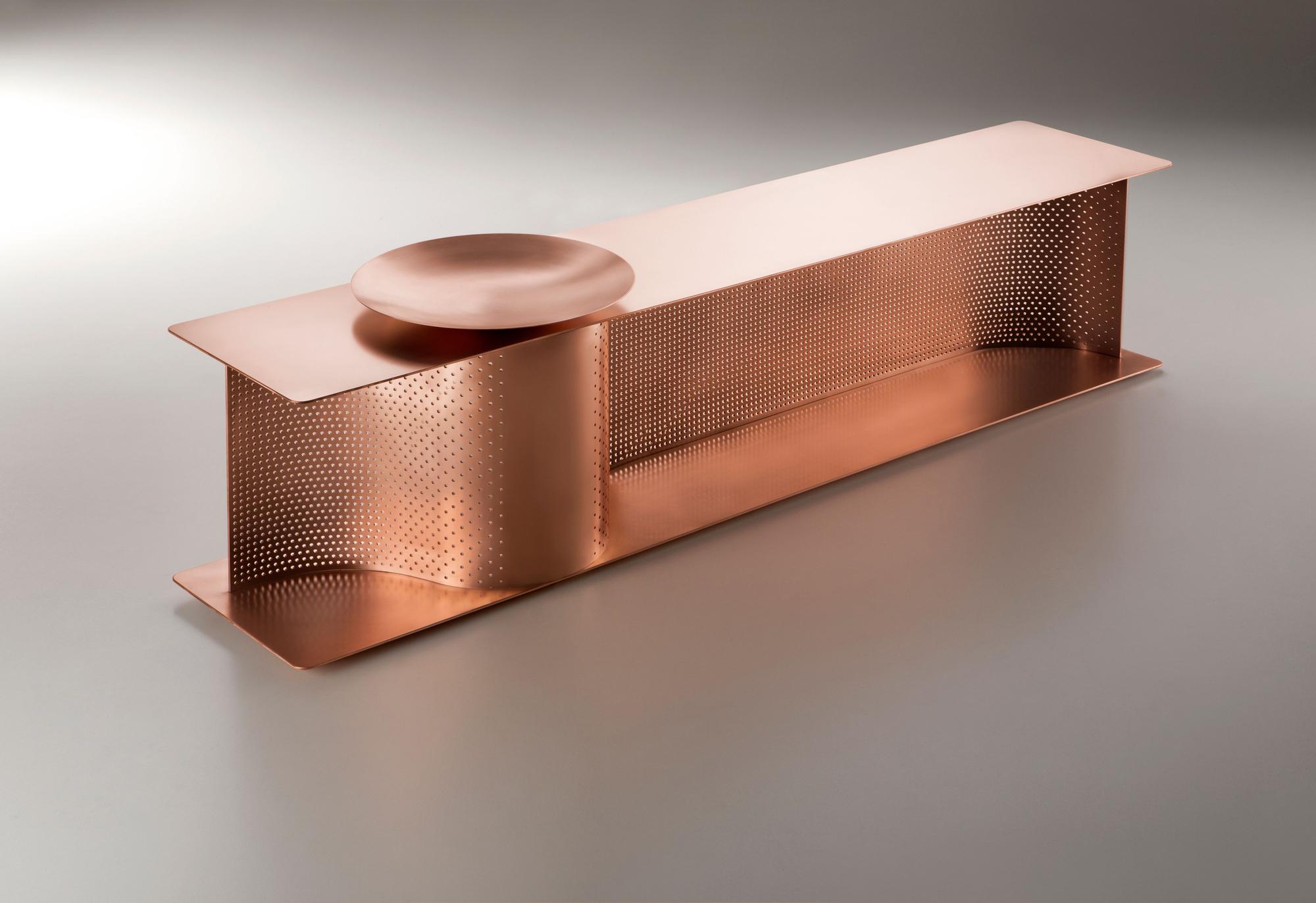 Wave Bench designed by Lanzavecchia+Wai for DeCastelli entirely made up of copper with 4mm thickness. The presence of an empty-pockets bowl creates a decorative perforated pattern. The finishing of this model is not lacquered by a protective