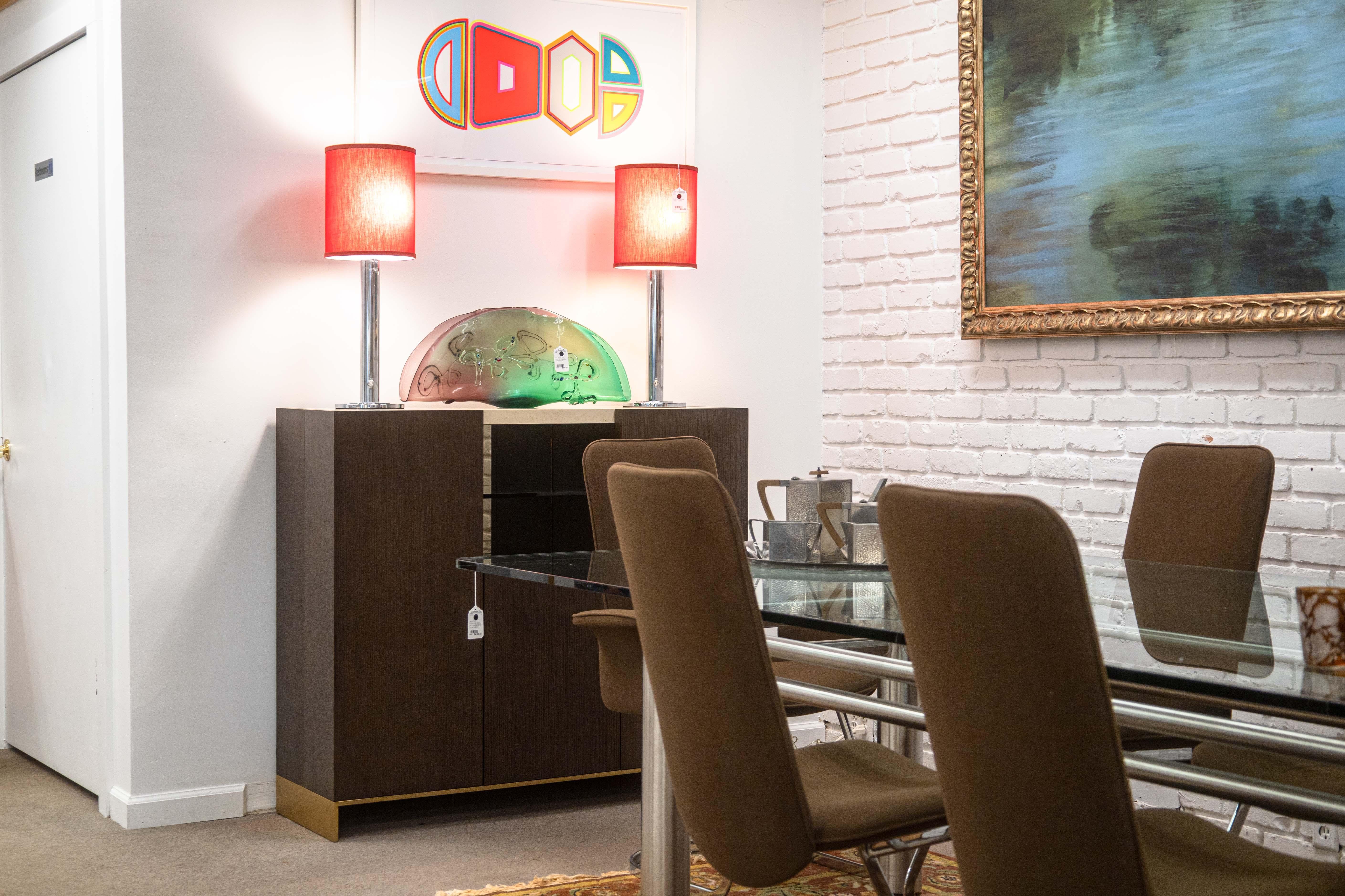 A Decca Home Bolier dry bar cabinet. This is an extraordinary contemporary dry bar with a very high quality set of materials and design. It features a thick, off white travertine top, which compliments the dark oak construction of the rest of the