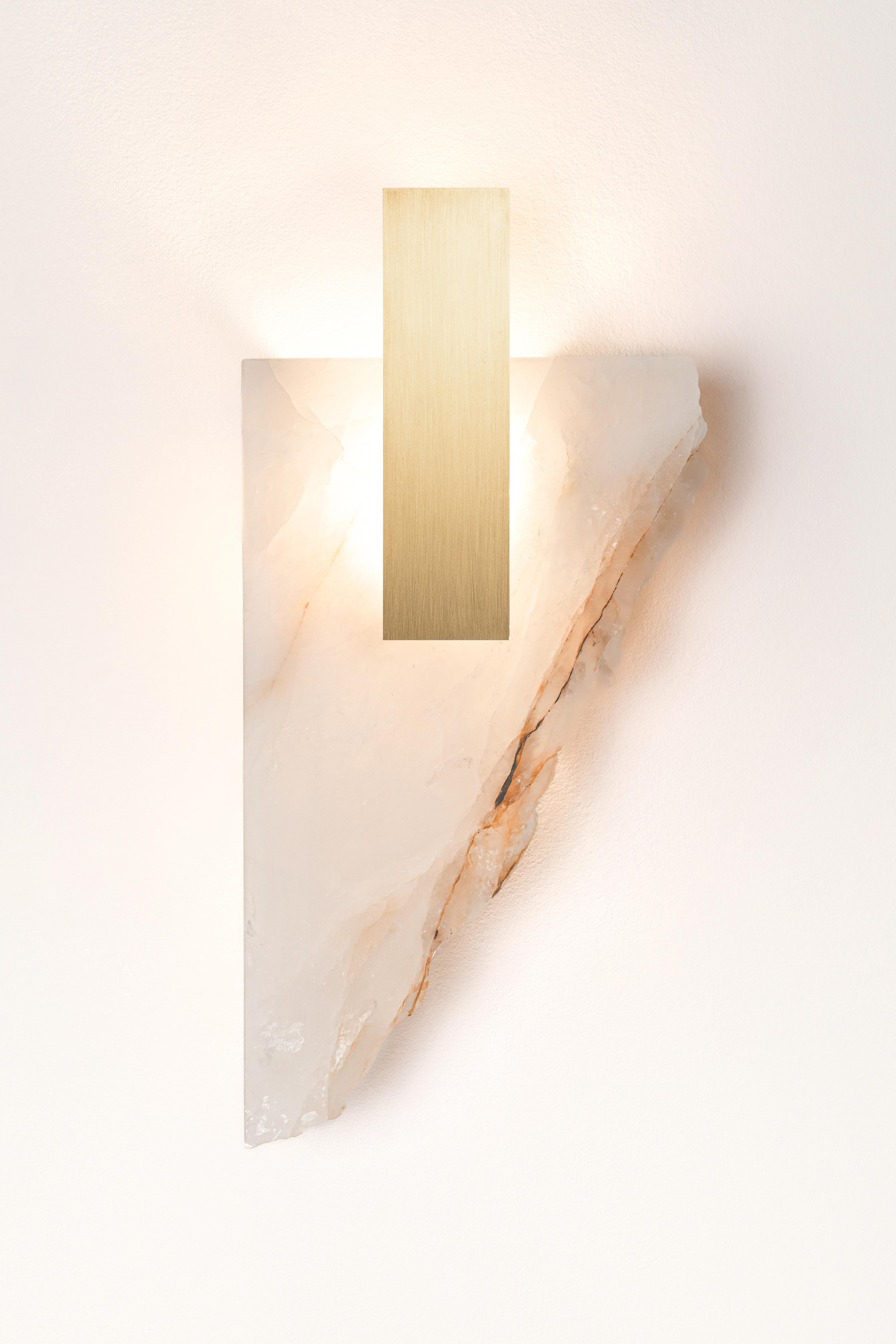 Déchirée Light Sculpture by Marie Jeunet
Dimensions: D 7 x W 21 x H 43 cm
Materials: Golden quartzite, brushed brass.


--MARIE JEUNET--
From grandparents to framers and lighting manufacturers, a childhood spent next to the
workshop of a great