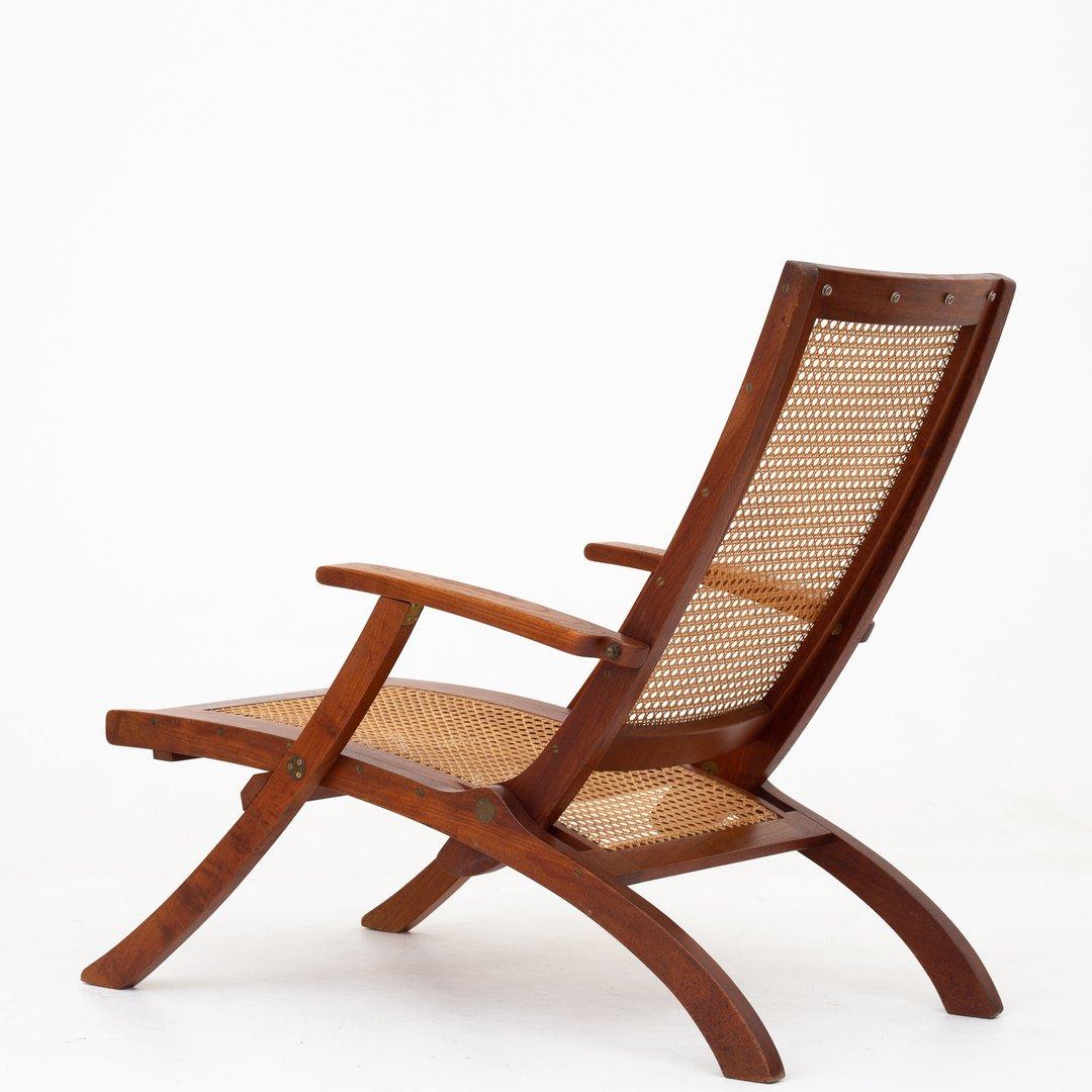 Deck chair in teak and French cane with brass hinges. Design 1933. Maker Rud. Rasmussen.