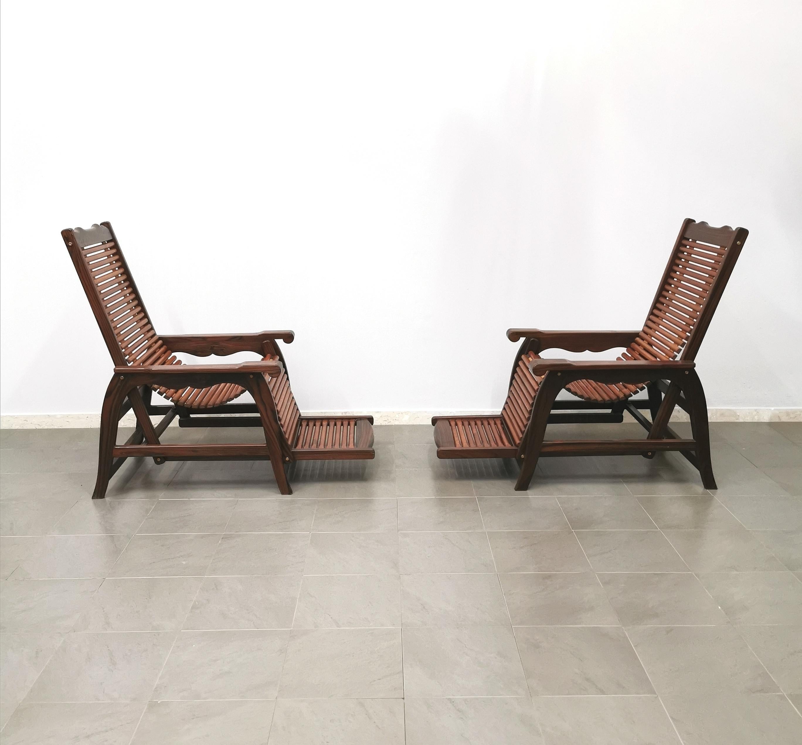 Set of 2 rare deck chairs produced in Italy in the late 60's.  1960s. Every single deck chair has been made of precious solid wood, a particular feature of the seat and back with solid wood rods of excellent quality and manufacture. Due to its