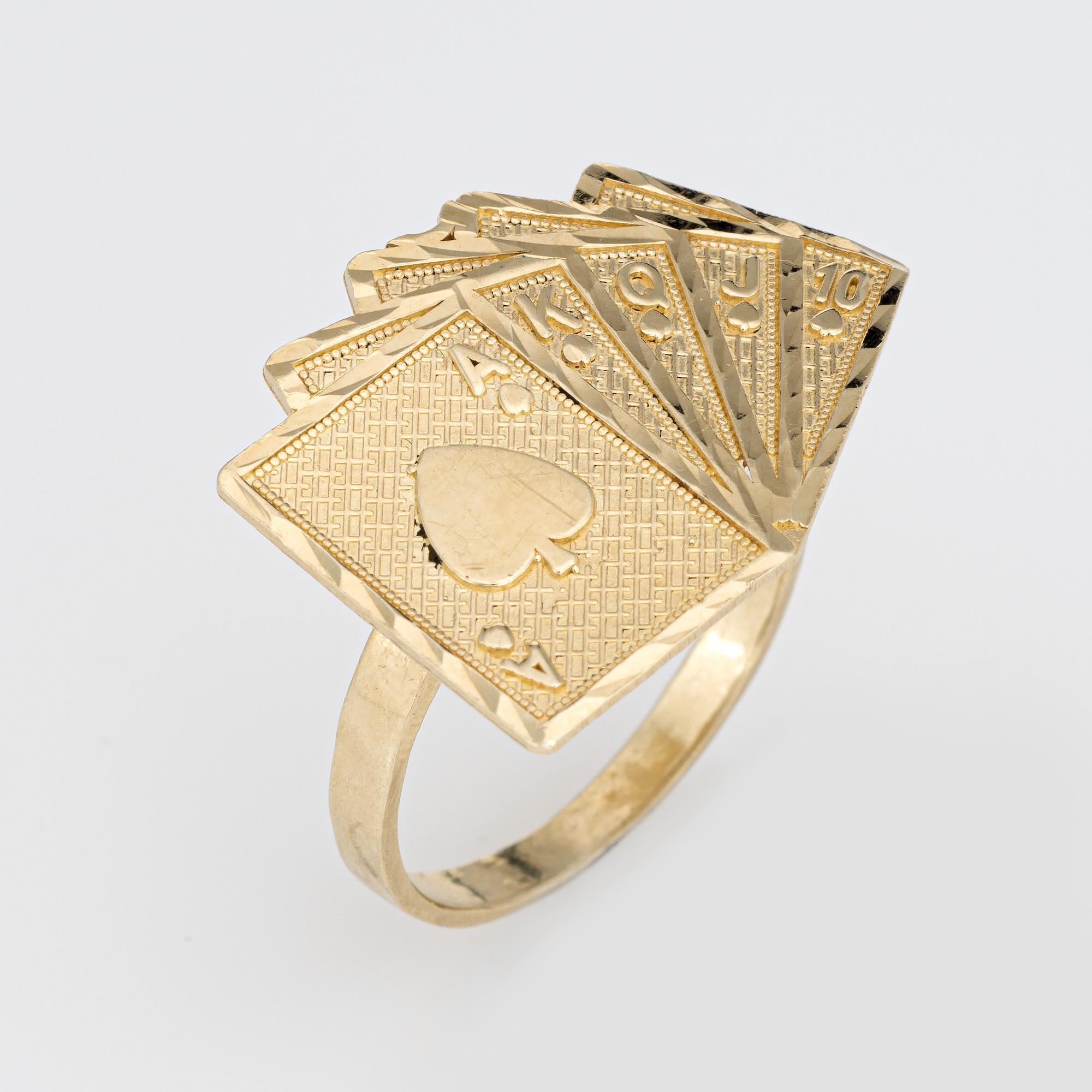 Finely detailed Deck of Cards ring crafted in 10 karat yellow gold. 

The royal flush is represented with an Ace of Hearts, King, Queen, Jack and 10 card. The ring sits flat on the finger, rising 2mm from the finger (0.07 inches).  

The ring is in