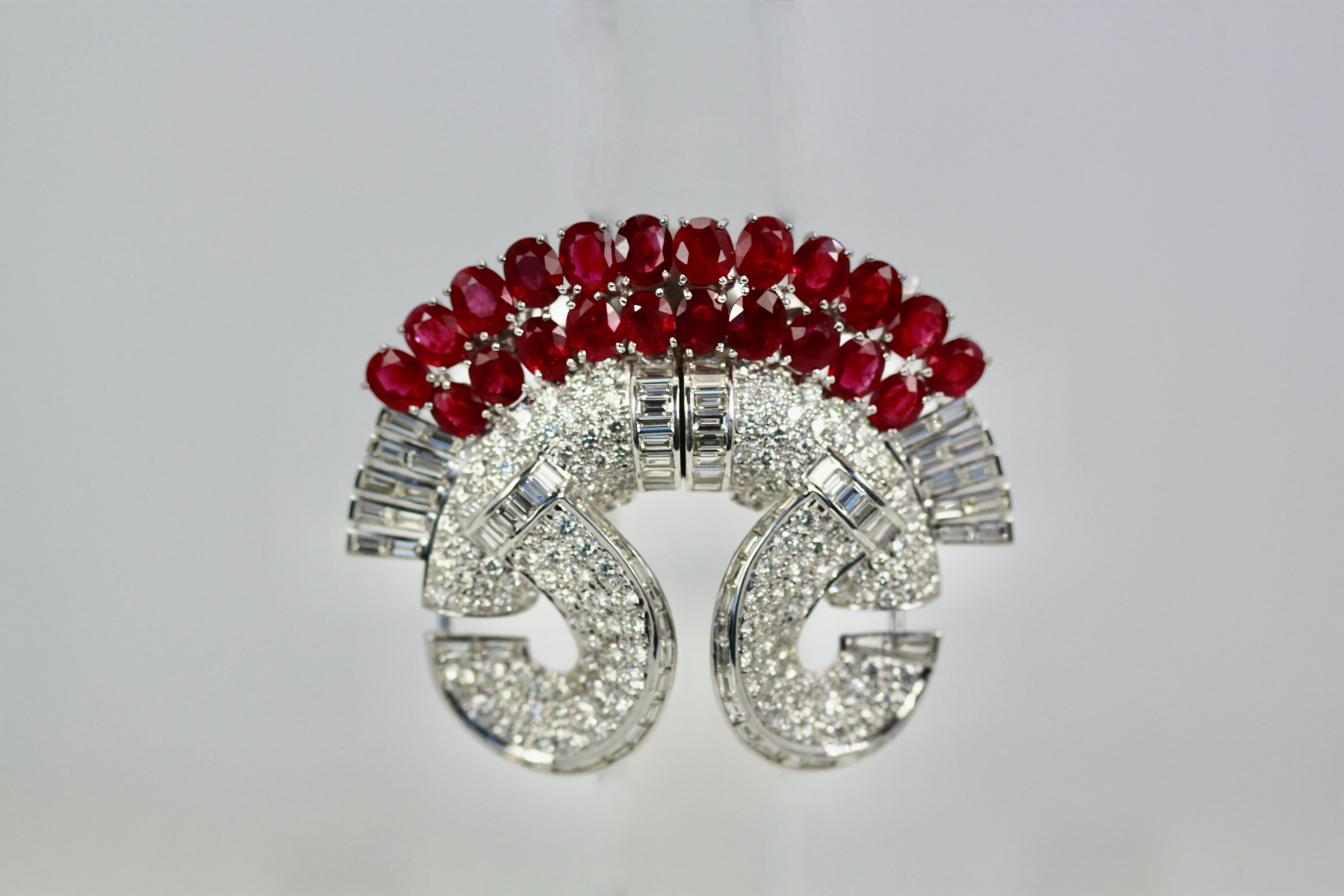 This gorgeous Ruby and Diamond Clip Brooch can be worn as is or you can remove the clip in back to be 2 single clip brooches or with a small removable clip they convert to earrings. There are 140 round 76 Baguette and 4 tapered Diamonds to total