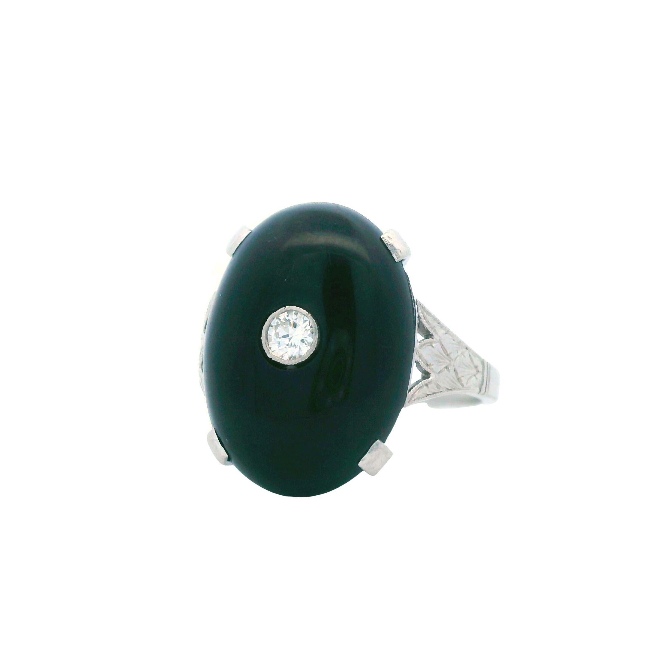 This wonderful Deco ring comes from the 1920's and is made in platinum with diamond and black onyx. The stunning craftsmanship and wonderful combination of materials provides a elegant look that is perfect for your next sophisticated event.