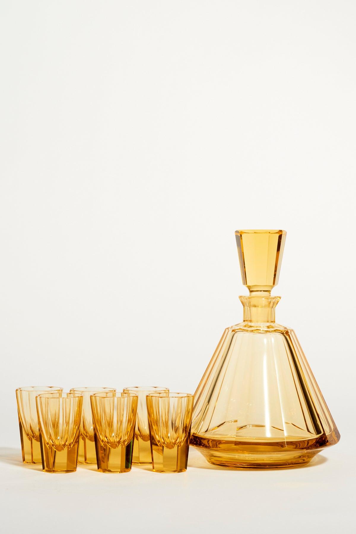 Czech faceted glass decanter set in amber yellow tones.
