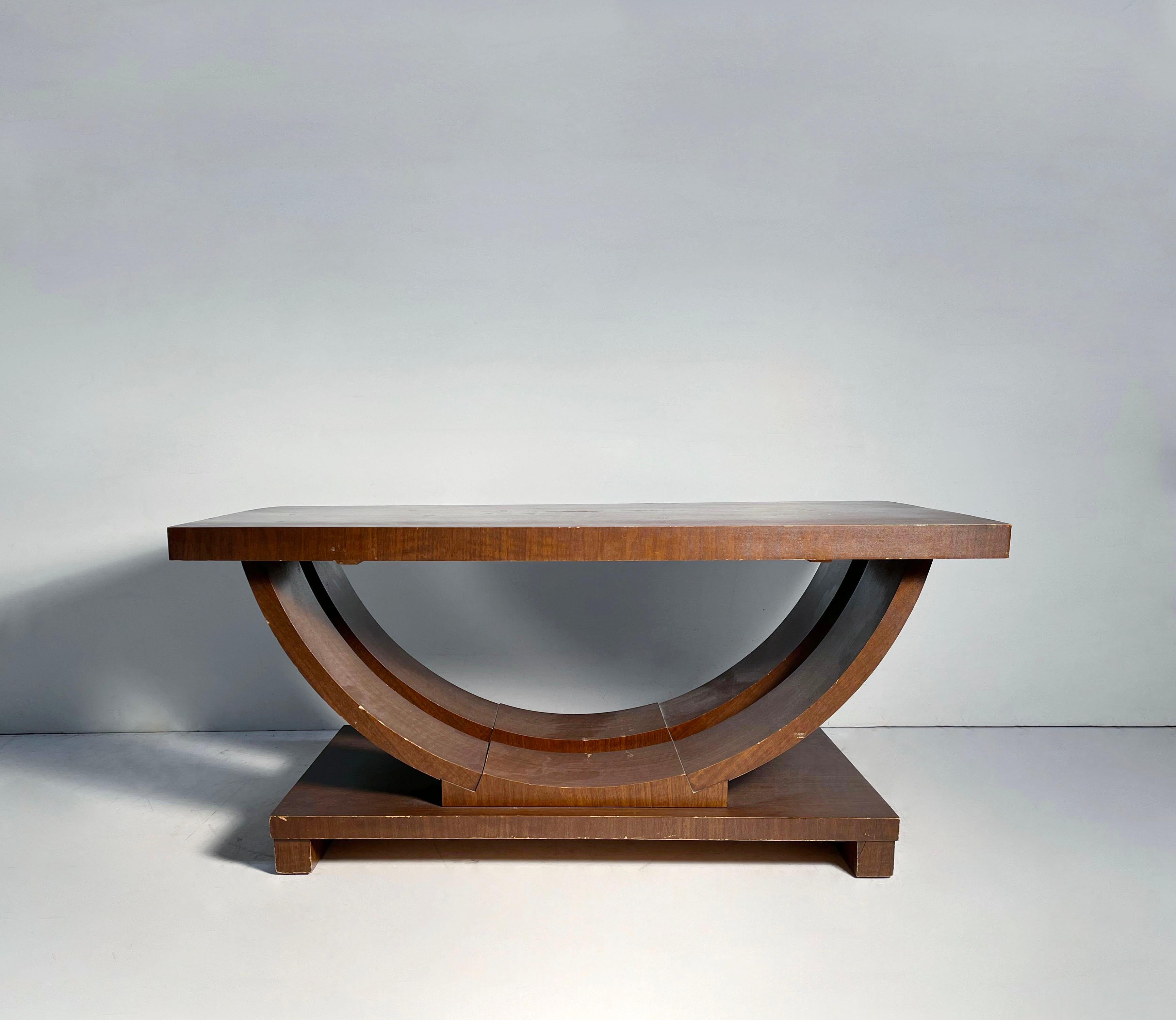 Style of Gilbert Rohde and Paul Frankl. Attributed to Modernage

Wear to the finish. Some minor wood separation on ends from age. Please request additional photos.

The finish appears to be a custom paint-like finish. So if refinished the grain