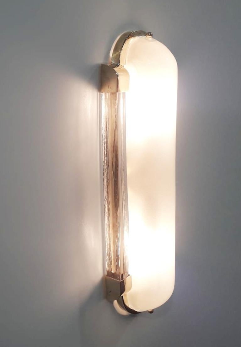 Italian Art Deco style wall light or flush mount shown in frosted Murano glass mounted on polished brass frame, designed by Fabio Bergomi for Fabio Ltd / Made in Italy
2 lights / E12 or E14 / max 40W each
Measures: Height 18.5 inches, width 6.5