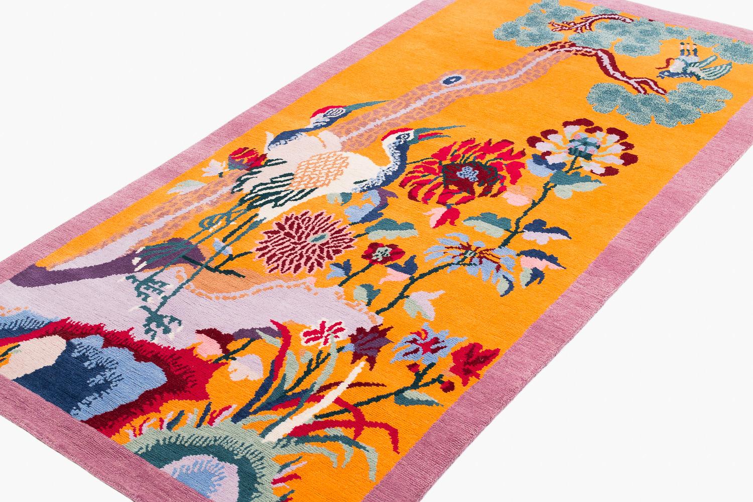 Deco Crane is a small runner rug is part of Joseph Carini's collection of 3x6s carpets. Inspired by Art Deco sensibility and East Asian designs, this carpet is a wonderful colorful accent piece. Remarkable for its fantastic orange field and