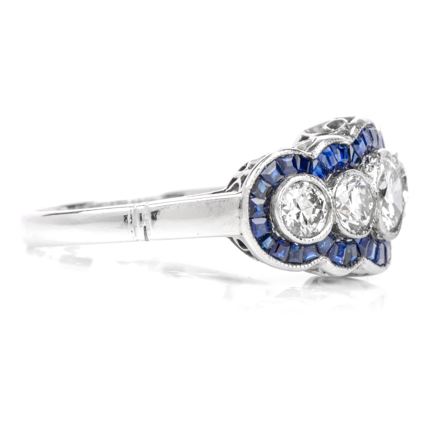A twist to a classic anniversary band.

This band features 5 round brilliant cut diamonds through the center of the the ring while a scalloping halo of French cut, deep blue Sapphire surround.

Cast in Platinum, this ring measures appx. 9.94 x