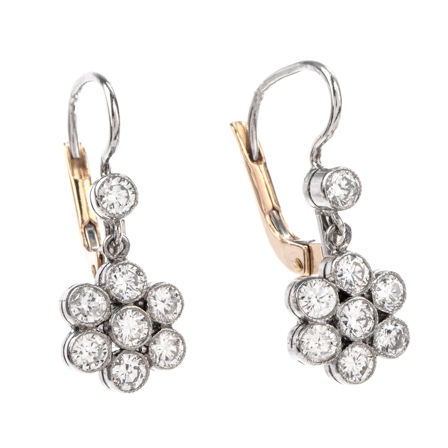 These Diamond Earring were inspired by a Dangling Floral motif and  crafted in Platinum and 18k yellow gold for backing.

A 7 diamond bezel set cluster is suspended from a single diamond creating movement as these are worn. Diamonds weigh approx.