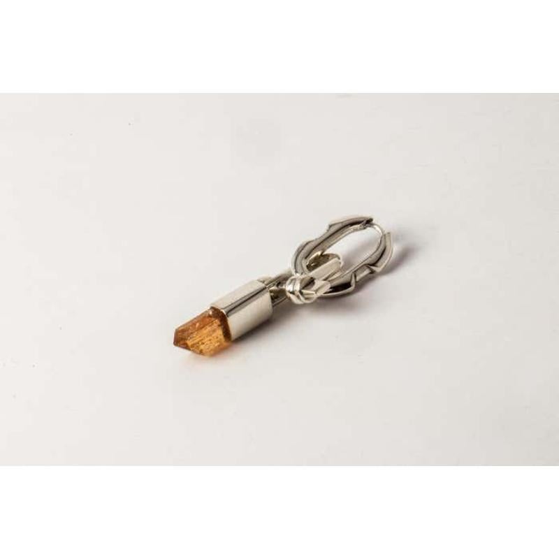 Dangle earring in polished sterling silver with imperial topaz crystal. 
Sold as a single piece.