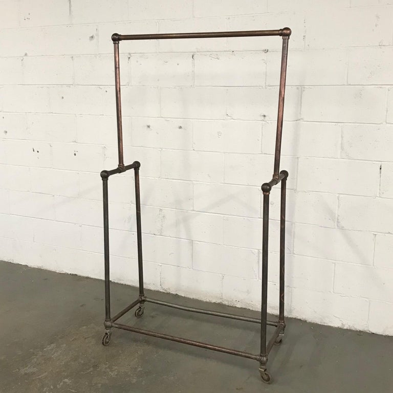 Deco Era Tubular Iron Rolling Garment Rack at 1stDibs