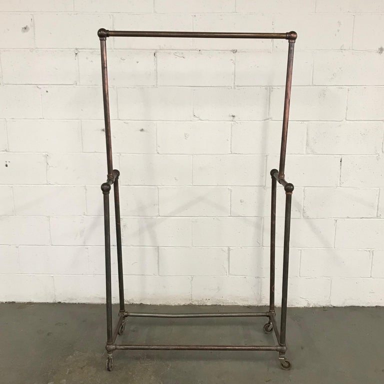 Deco Era Tubular Iron Rolling Garment Rack at 1stDibs