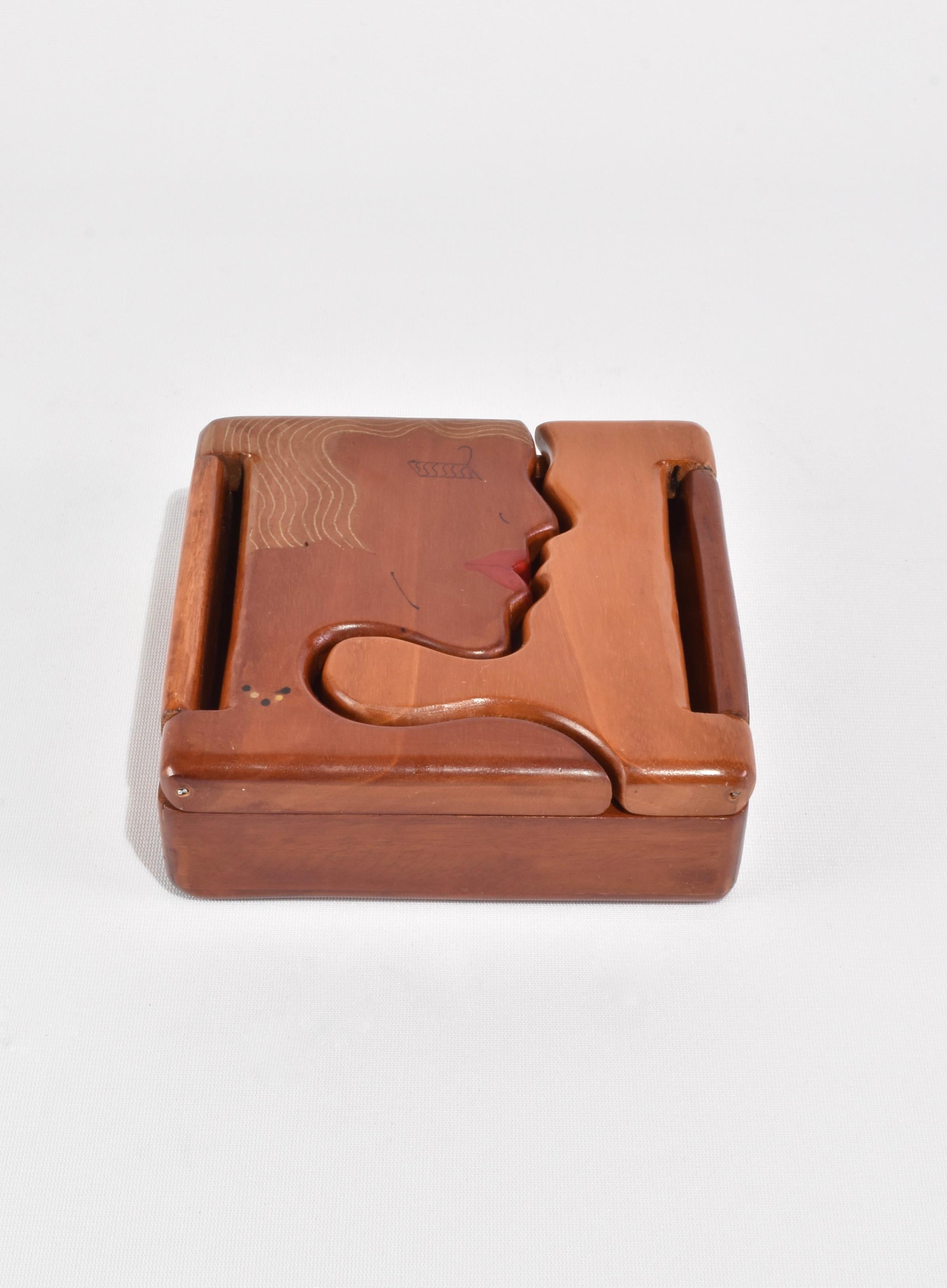 Stunning vintage hand-carved wooden box with a face motif hinged lid.