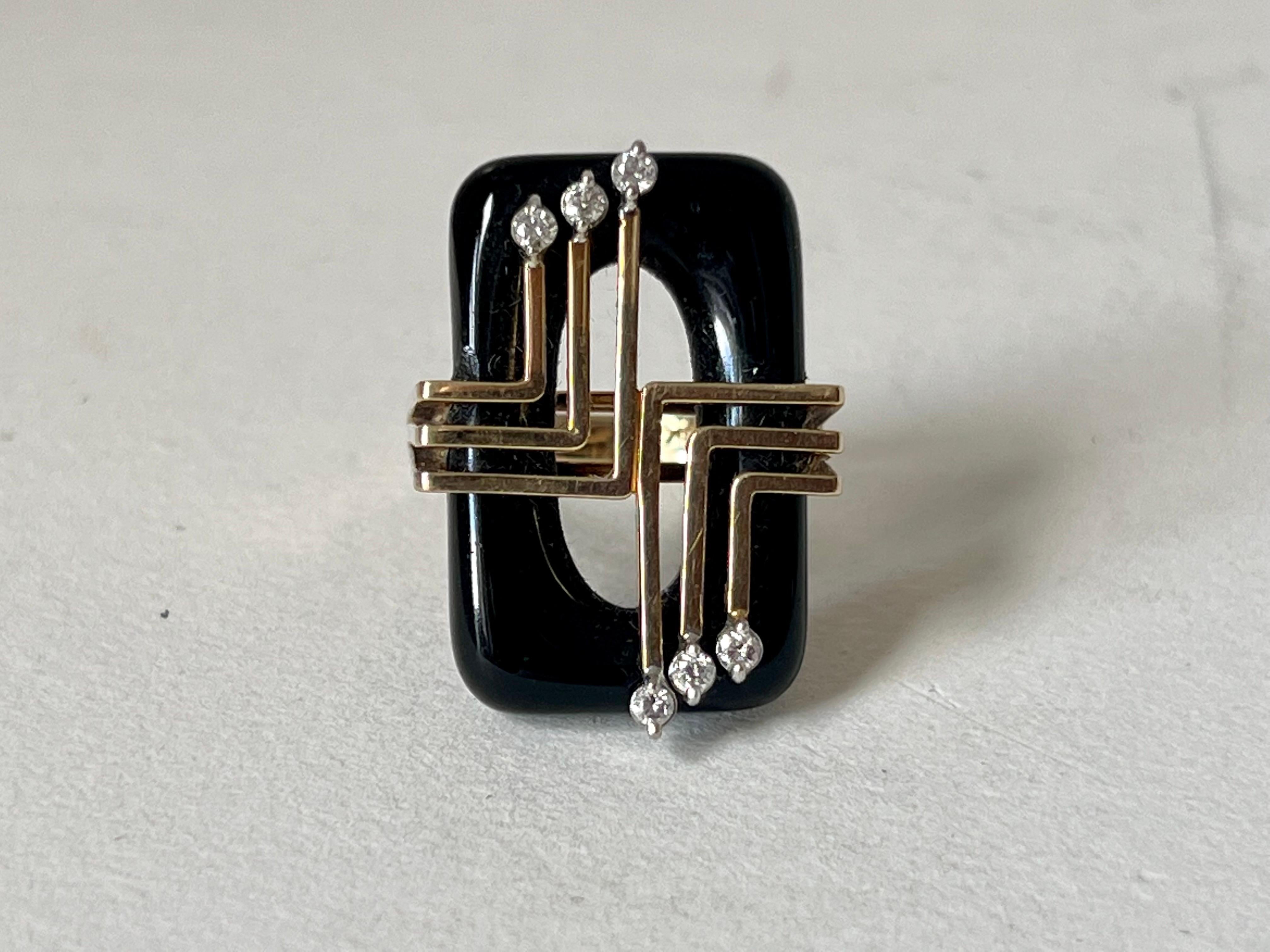 1970's Art Deco inspired Onyx and diamond ring in 14K gold setting.
Very little wear by age and use.