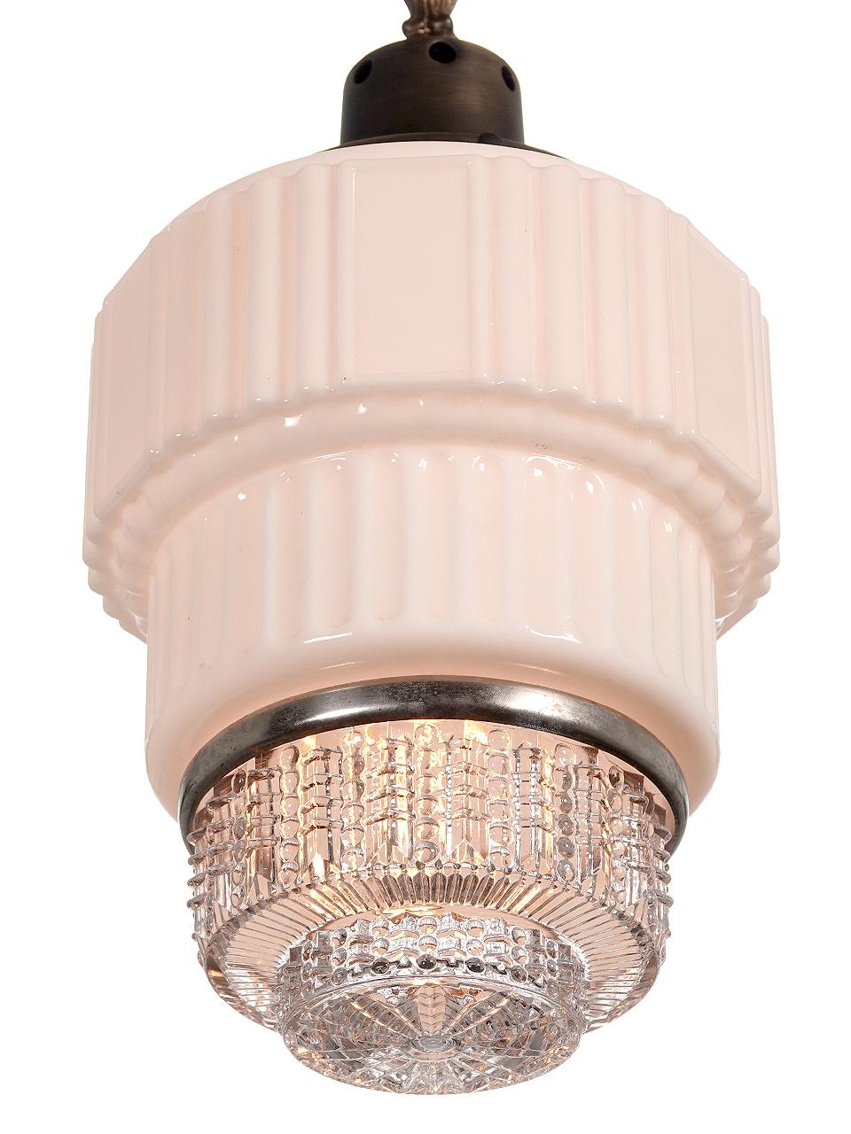 We only have one example of this beautiful Deco Skyscraper pendent. The top had a nice ornate crown and the bottom is very deco in style. We like distinctive look of the two piece milk and clear of glass shade. We will finish the lamp to your drop