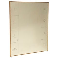 Decorative mirror with silk-screened designs and a brass frame from the 1940s