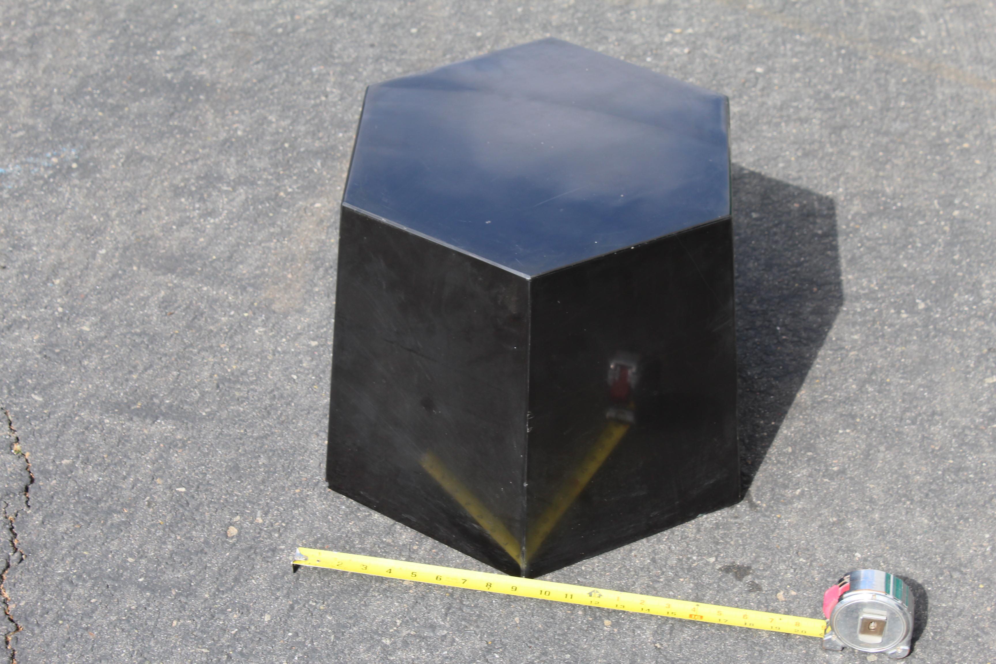 A custom designed and custom made absolute black marble pedestal for an Antique Gallery in Los Angeles. It is a Hexagon design and not too tall at 14