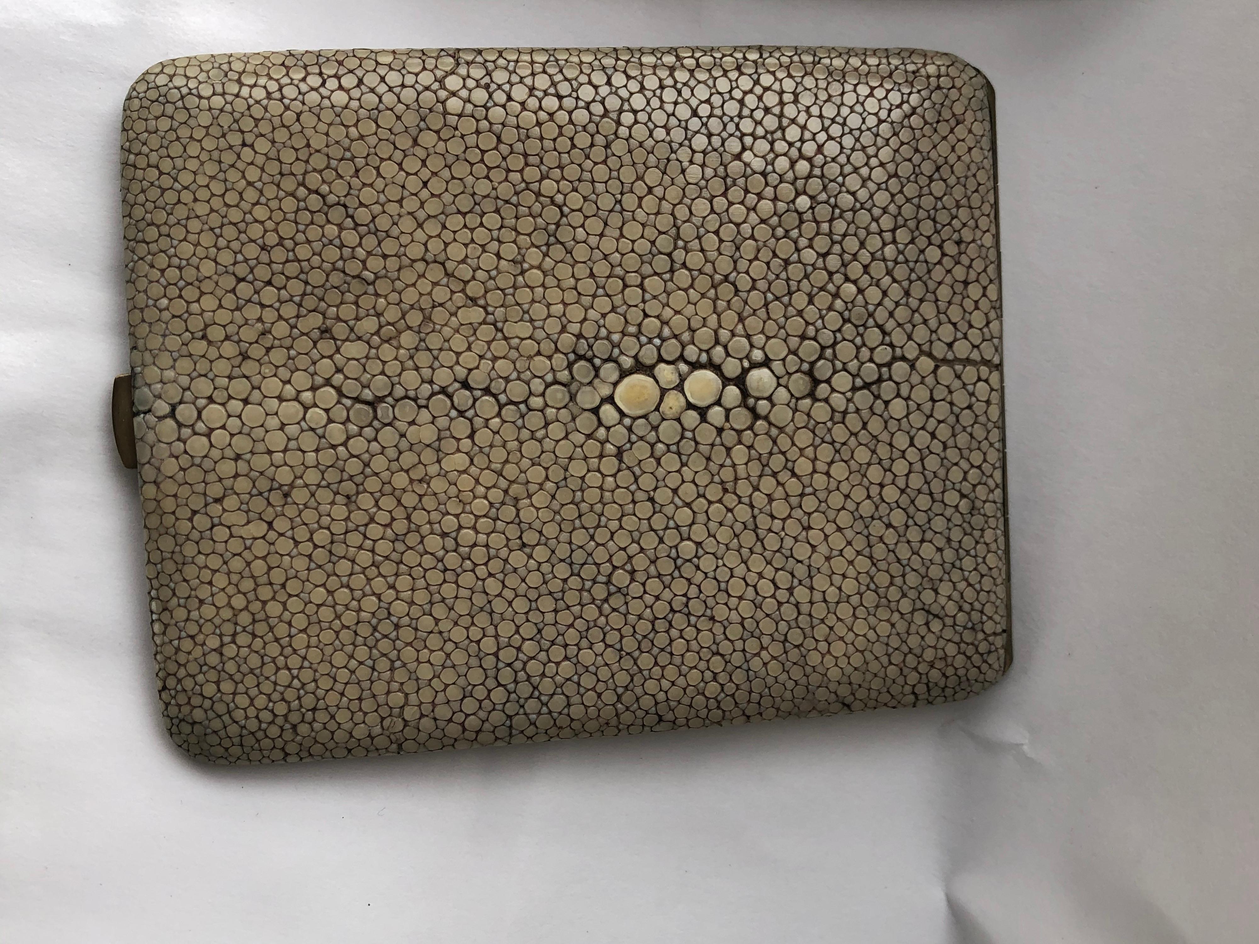 Lovely pale green deco shagreen cigarette case and a shagreen card case. Probably French. Cigarette case has particularly lovely shagreen on the top with the stingray's belly button centered on the case, as it should be. These are not a set but are