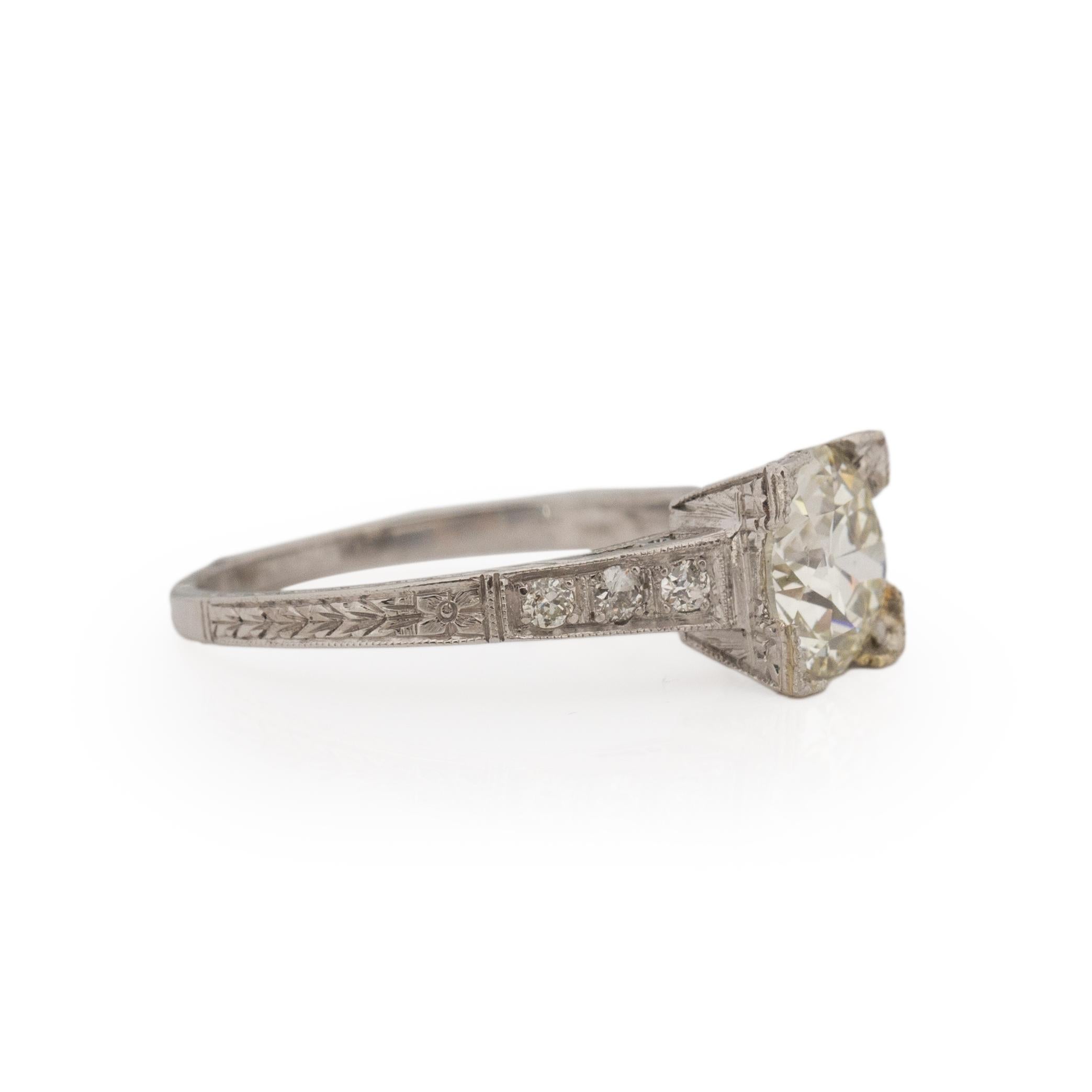 It is impossible not to catch eyes with this dazzling engagement ring! The piece looks like a ring Jay Gatsby would give to Daisy! Crafted in platinum     the center Old European Cut 1.42Ct is sparkling with elegance! This piece would make a perfect