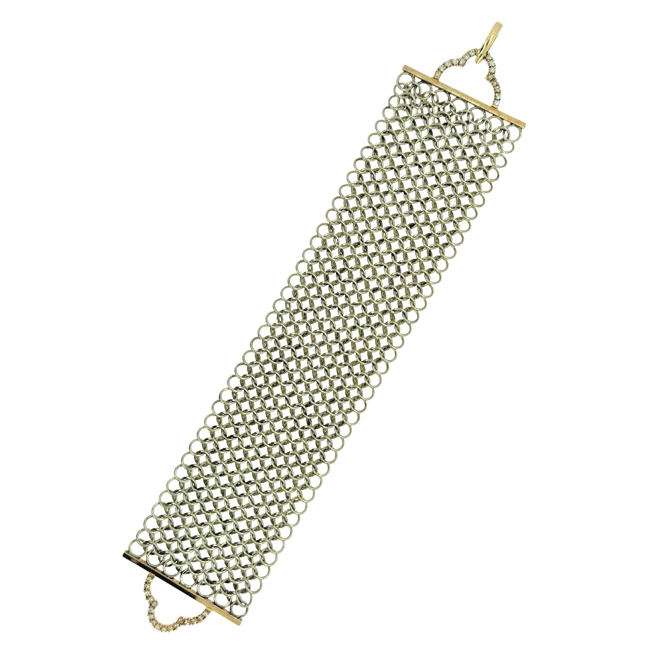 A unique bracelet design for women to feel powerful. The Deco Power Bracelet is a wide style that is flexible and drapes the wrist. The weight is evenly distributed and feels cozy as it moves with arm and wrist movement. 
The silver chainmail is