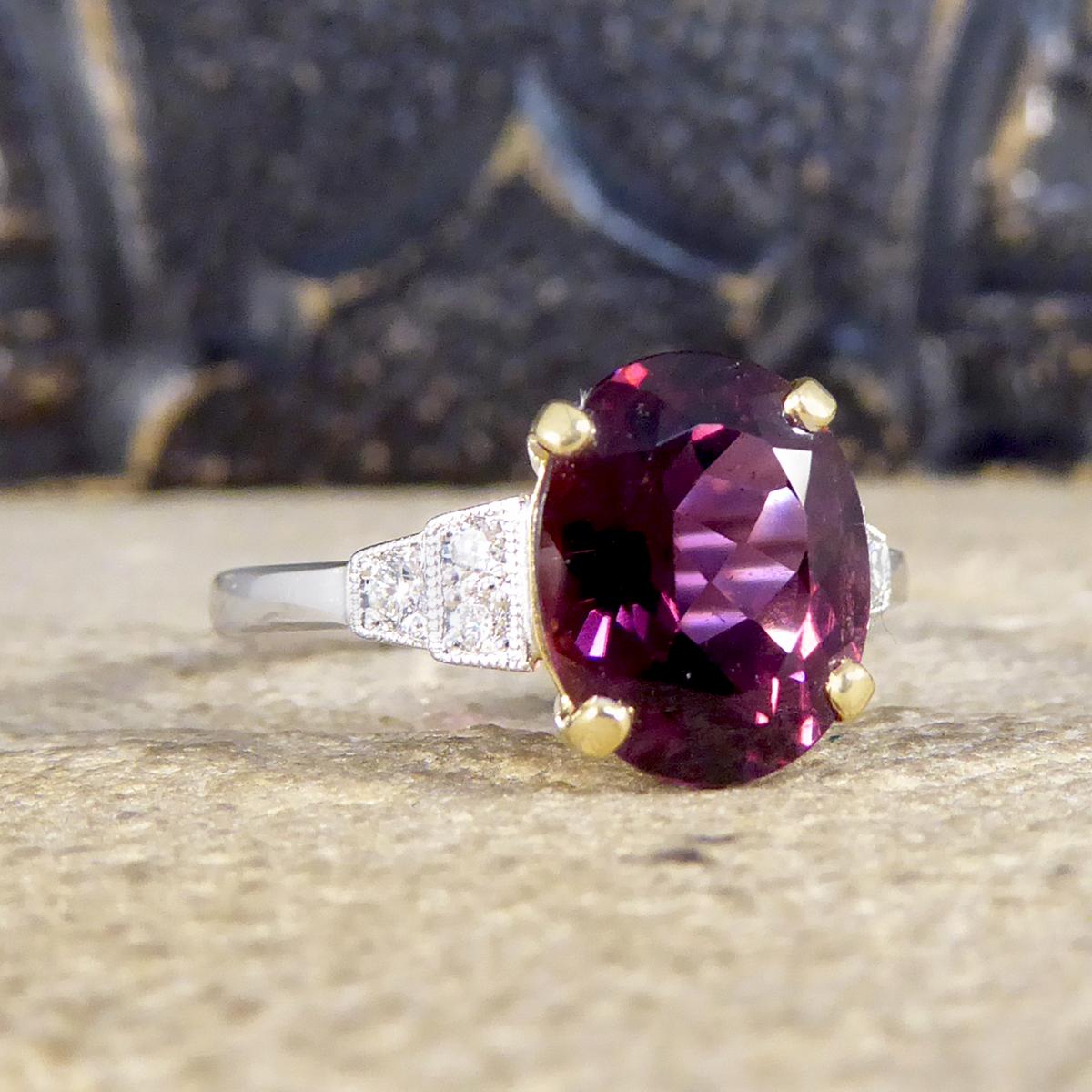 This stunning ring has been hand crafted and is new and never worn. It has been designed and carefully crafted to resemble an Art Deco style ring with mesmerising raspberry Red Tourmaline gemstone in the centre weighing 2.77ct set in 18ct Yellow