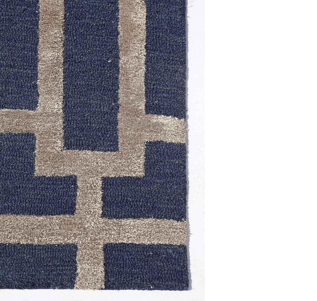 Discover a harmonious blend of modern design and age-old artistry with our hand-tufted rugs. Each piece is a canvas where contemporary patterns meet the soul of traditional hand-tufting techniques. Originating from Jaipur, a city renowned for its