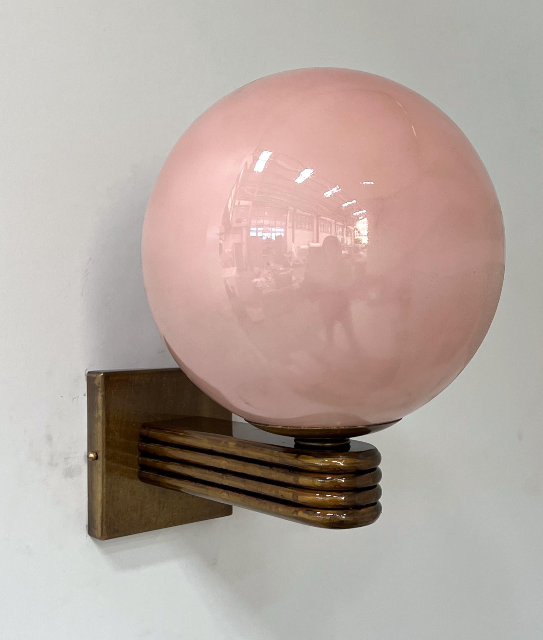 Italian Art Deco style wall light with opaque pink coral Murano glass globe mounted on bronzed finish frame, designed by Fabio Bergomi for Fabio Ltd, made in Italy
1 light / E12 or E14 type / max 40W
Measures: Height 12 inches, width 8 inches, depth