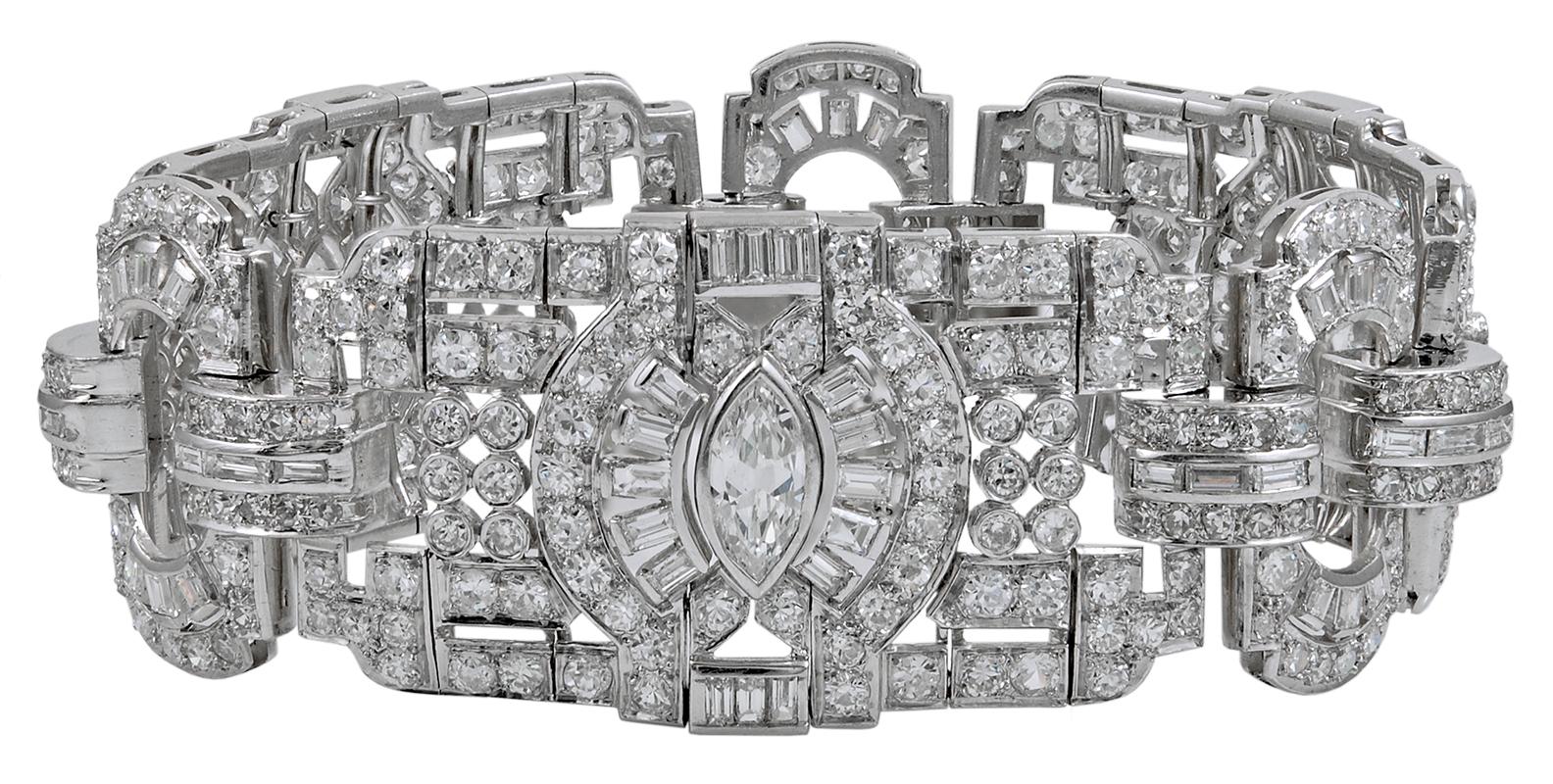 Art Deco-Style Diamond Articulated Link Bracelet in Platinum.
Diamond weight approx. 20.00 carats total. Measures approx. 7.75″ in length, inner circumference approx. 7.5″, 1″ width, 0.25″ in height off the wrist. Seamless foldover clasp with chain