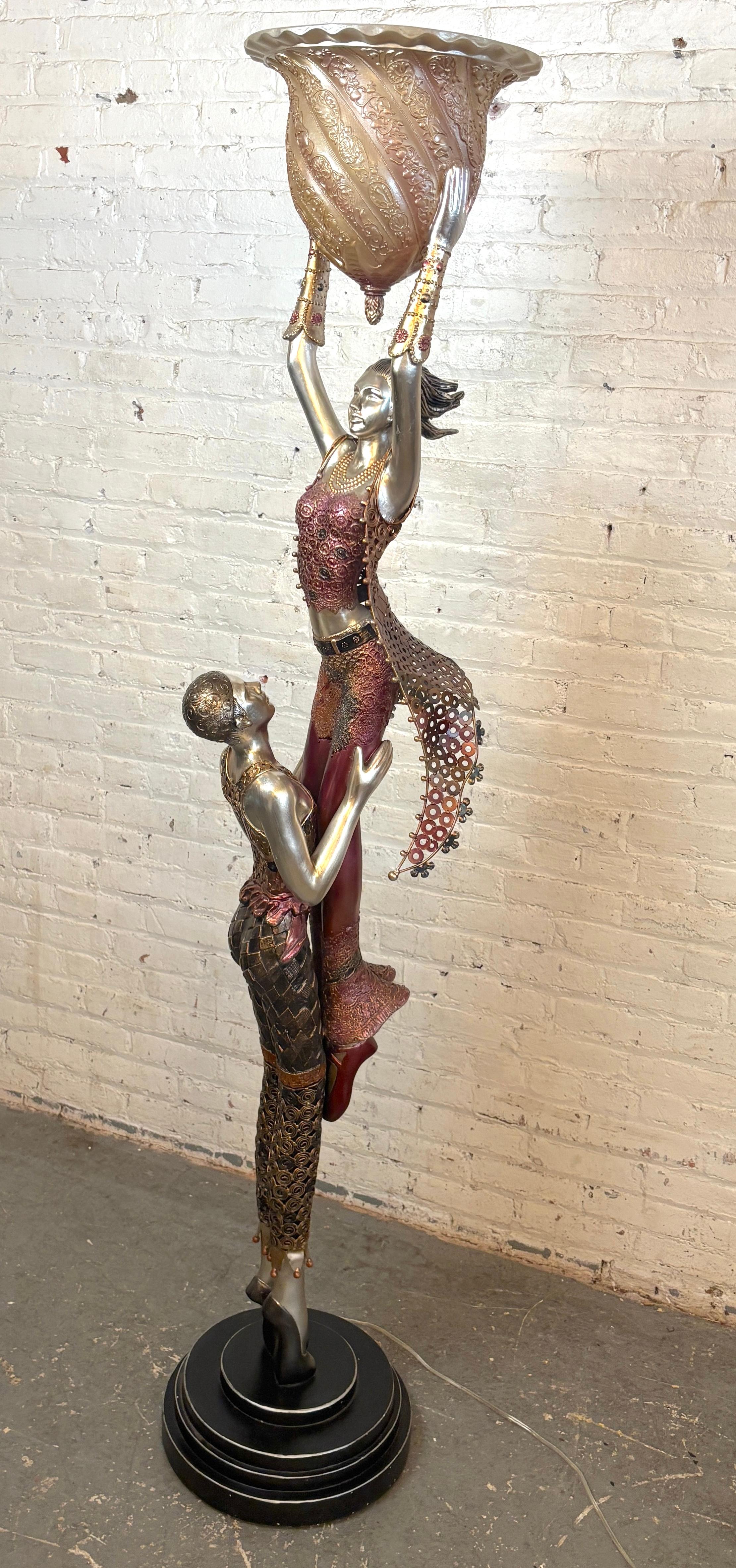 Almost seven foot tall floor lamp with two dancers in resin and mixed metal. Hand painted detail with a warm glowing dome shade.
Please confirm location NY or NJ