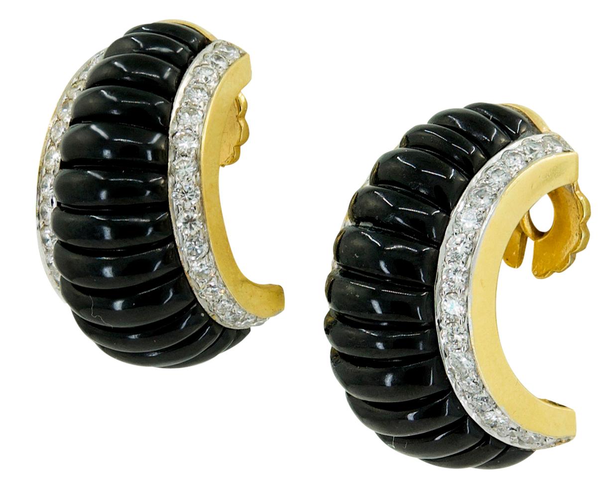 Art Deco Style Onyx Diamond Half Hoop Bombe Earrings in 18k Yellow Gold.

A pair of Art Deco Style half-hoop earrings in a tapered bombé design. Each on-the-ear clip features fluted reeds of carved onyx framed with a row of round brilliant diamonds