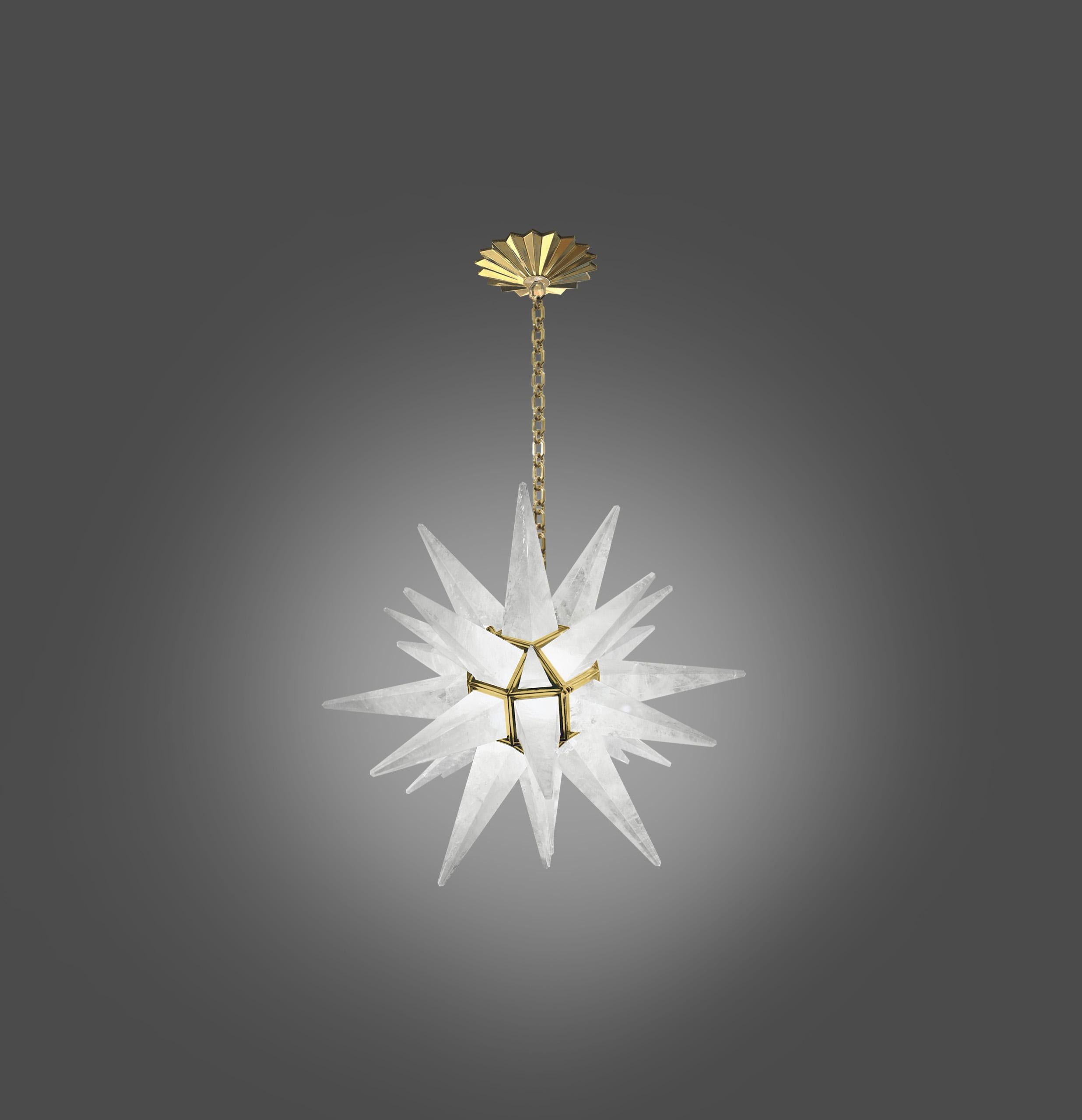 Deco style star forms rock crystal chandelier with polished brass frame. Created by Phoenix Gallery, NYC. 
2 sockets installed. Use two 100 watts led warm light bulbs. The total is 200 watts. The metal finish available in polished nickel and