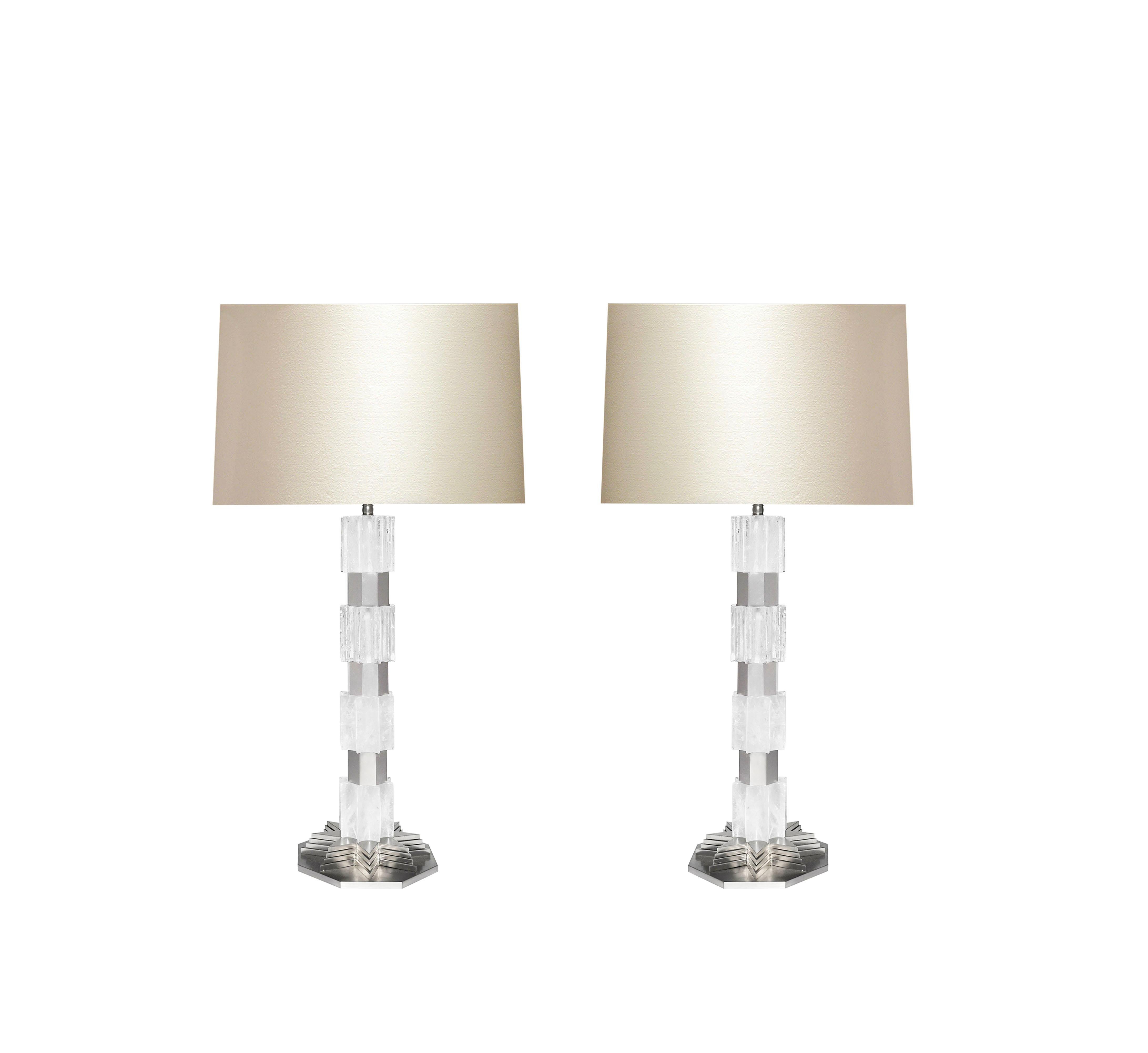 A pair of deco style rock crystal quartz lamps with nickel plating inserts and bases, created by Phoenix Gallery, NYC.
To the rock crystal: 19 in H.
(Lampshade not included).