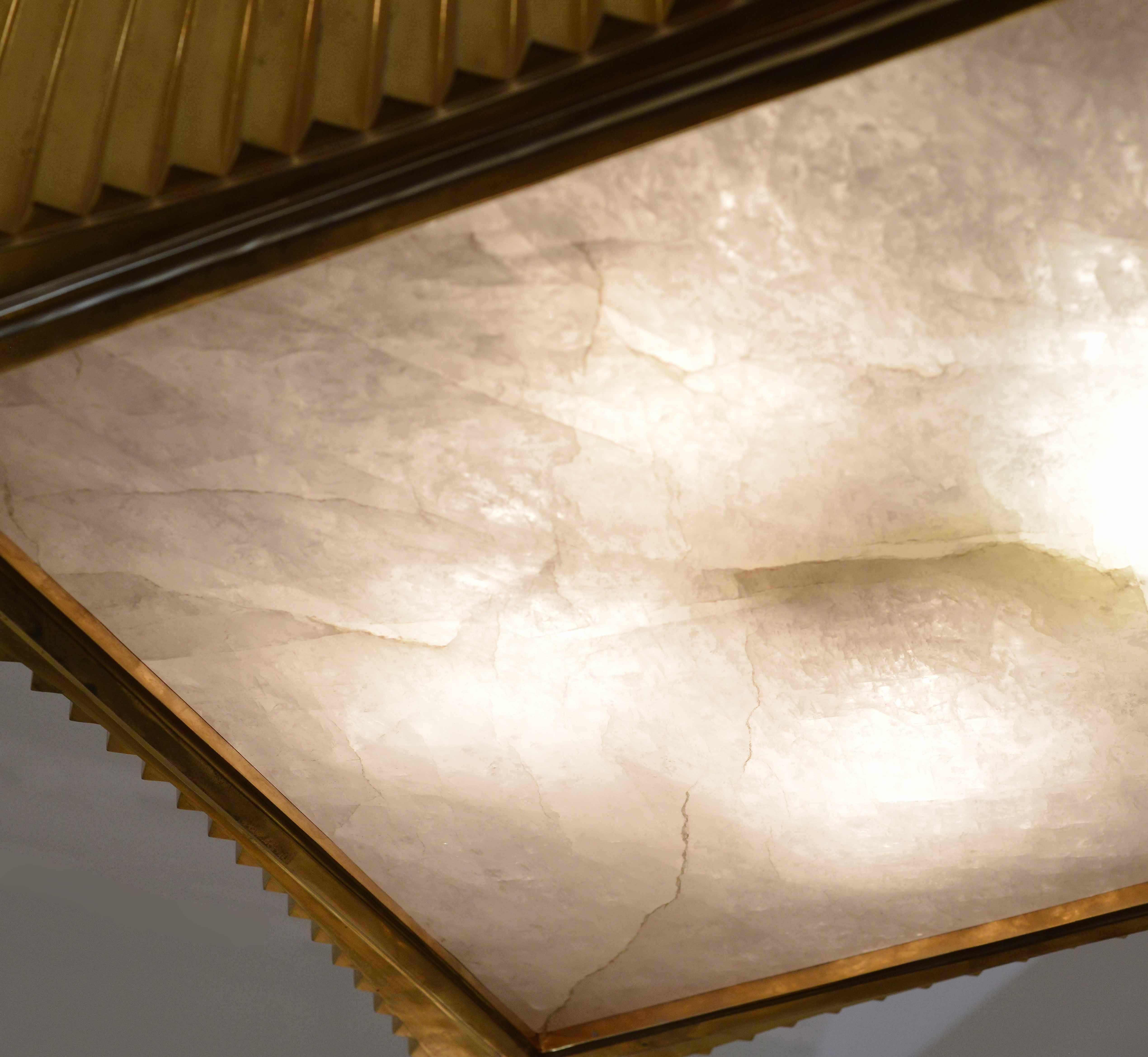 Finely cast brass in the deco style. Square in curve edges frame, with rock crystal quartz insert on top and bottom, created by Phoenix Gallery, NYC.

