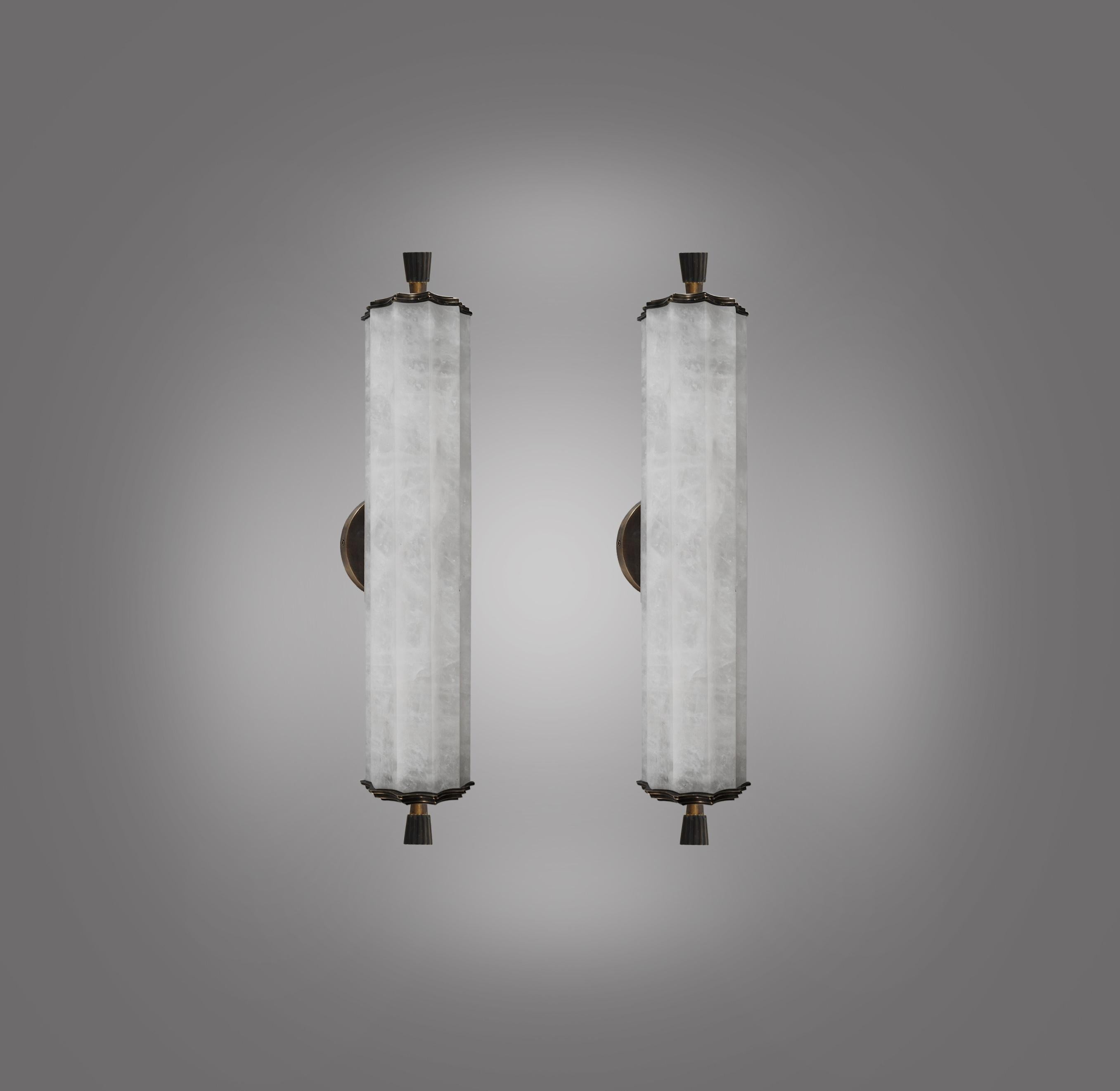 Pair of fine carved deco style rock crystal sconces with antique brass decorations. Created by Phoenix Gallery.
Two sockets installed.
Use two Led warm lights. 160 Watts in total.
Custom size upon request.