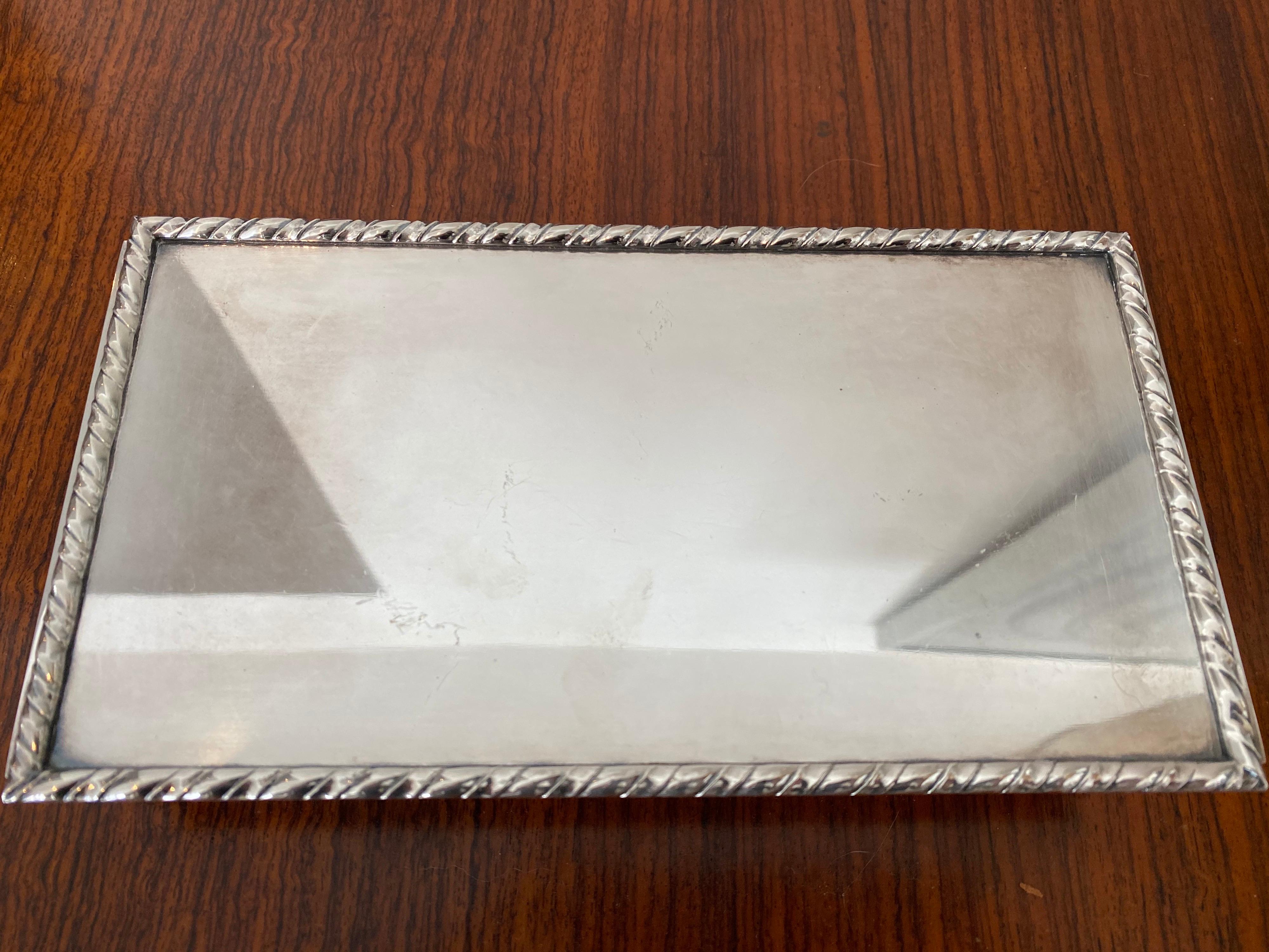 A deco style silver plate box. Interested riveted and heavy construction with concave base interior. Marked 